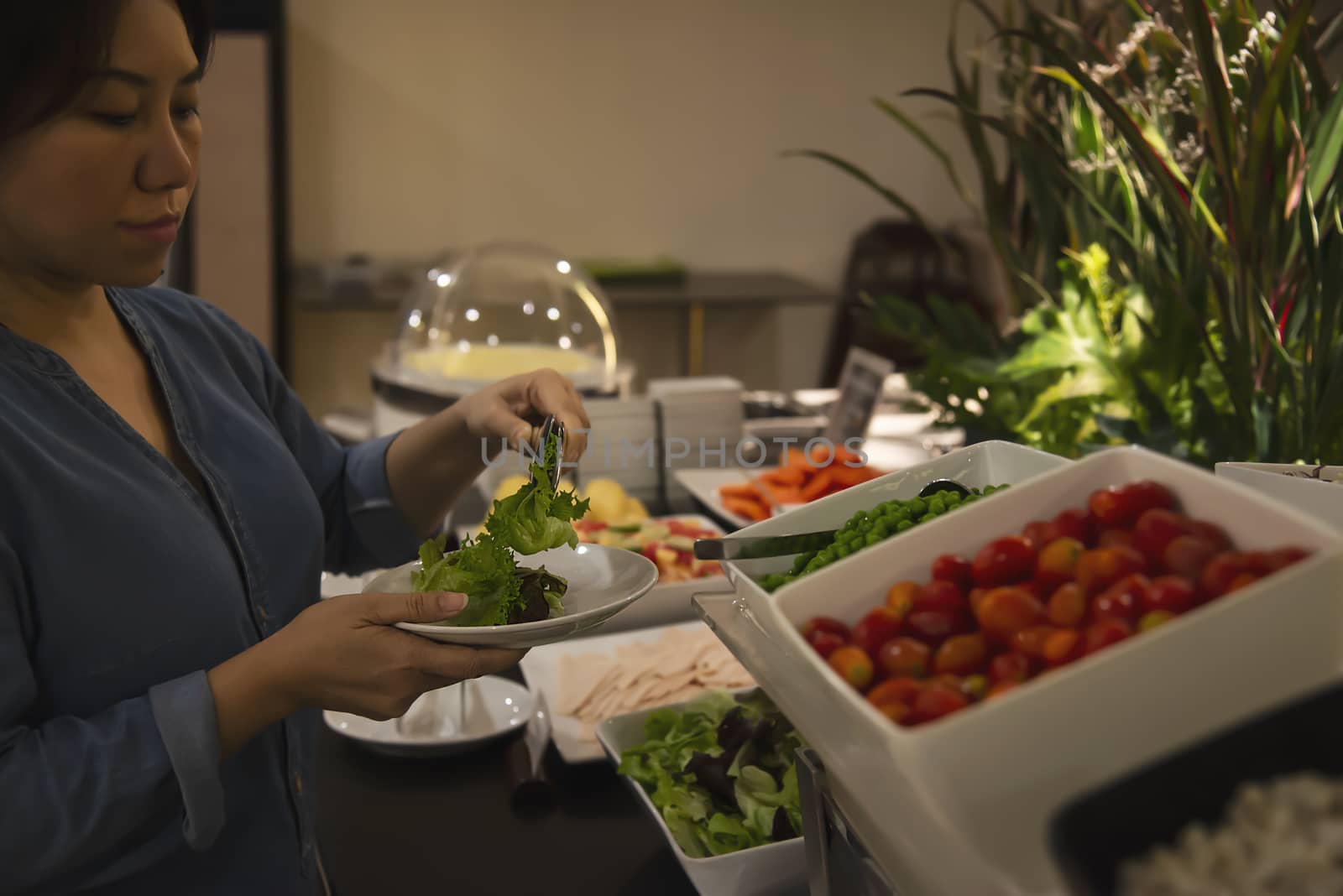 Woman eat the breakfast set in a hotel - people with breakfast in hotel concept