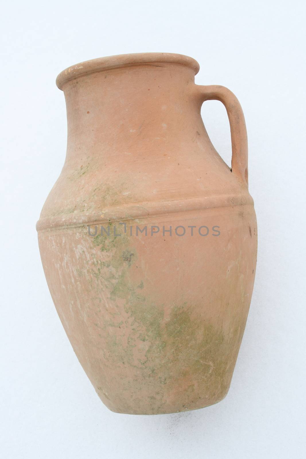 Terracotta amphora lying on a white background  liegende Terrakotta Amphore auf wei�em Hintergrund   by hadot