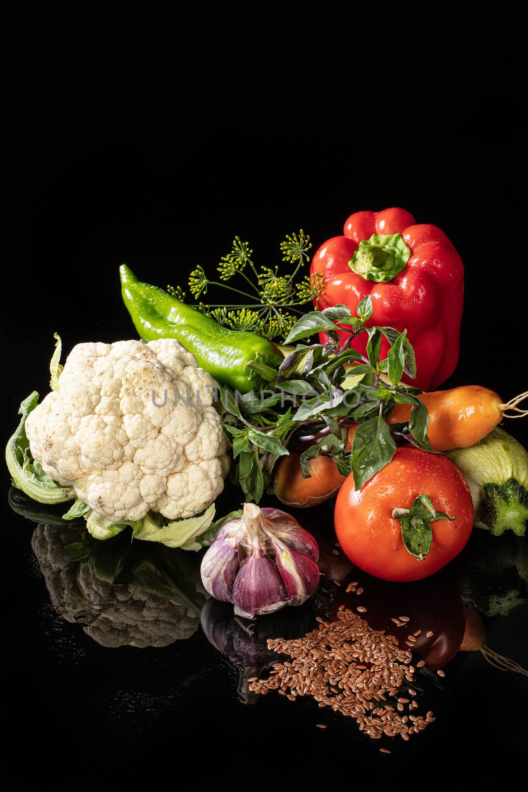 Still life with vegetables on a glass background