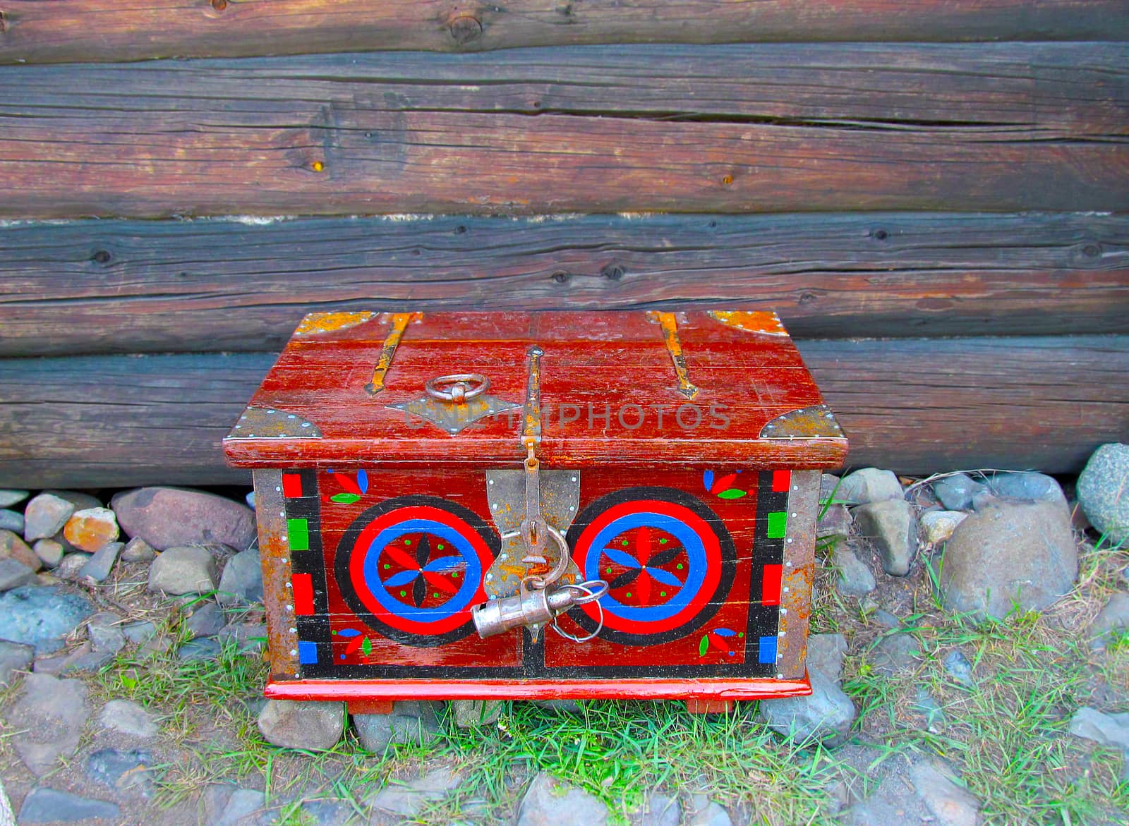 Old painted chest red made of wood .