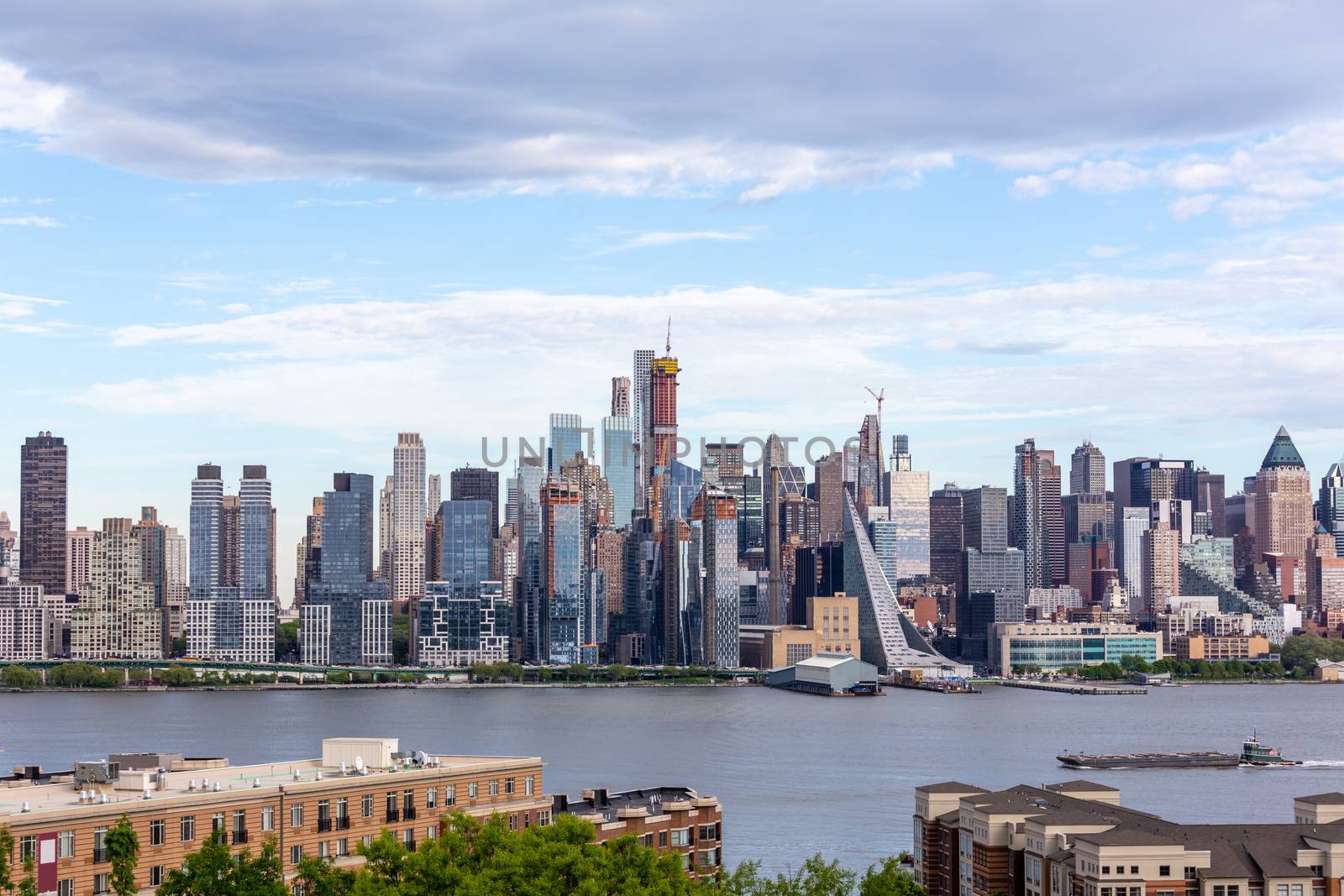 New York City midtown Manhattan skyline panorama view from Boulevard East Old Glory Park over Hudson River.