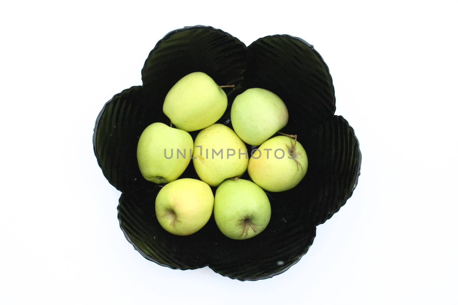a black fruit bowl with green apples    eine schwarze Obstschale,mit gr�nen �pfelnow