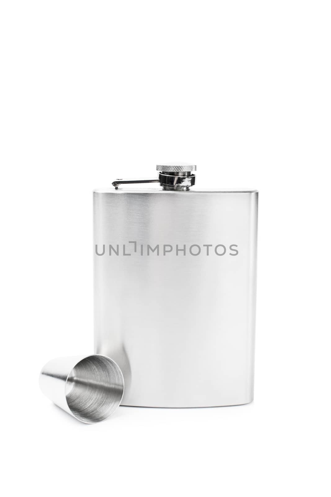 Stainless steel flask with a small metal cup, isolated on white background.