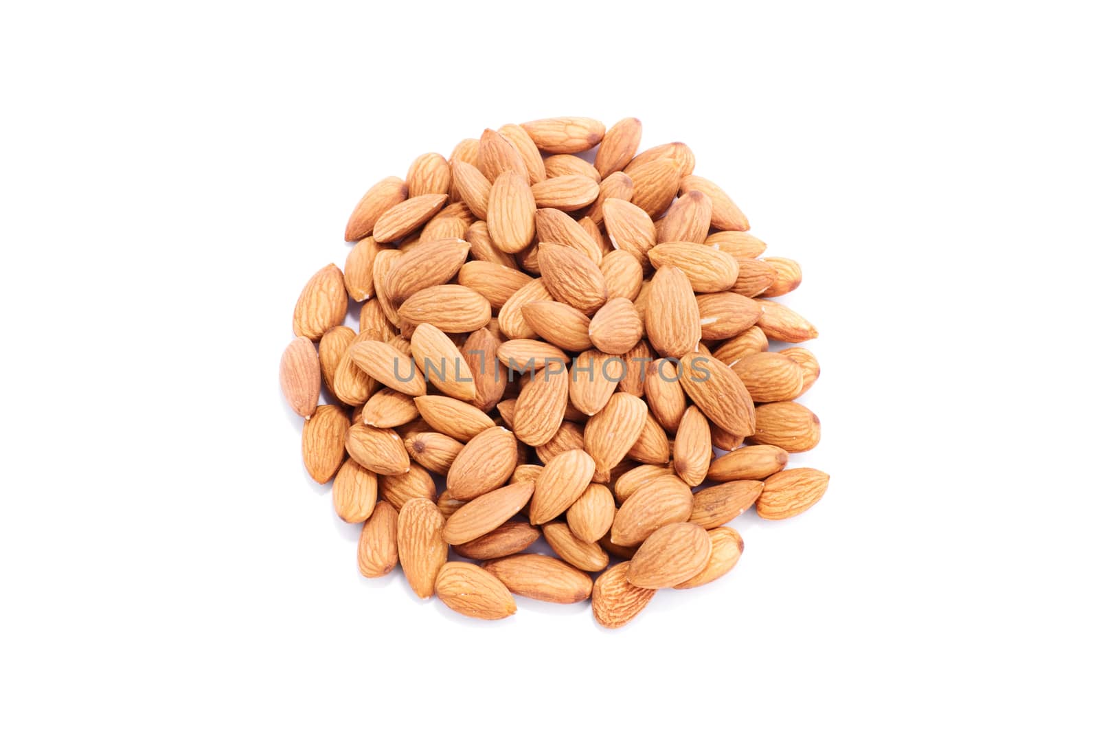 Top view of a heap of almonds, isolated on white background.