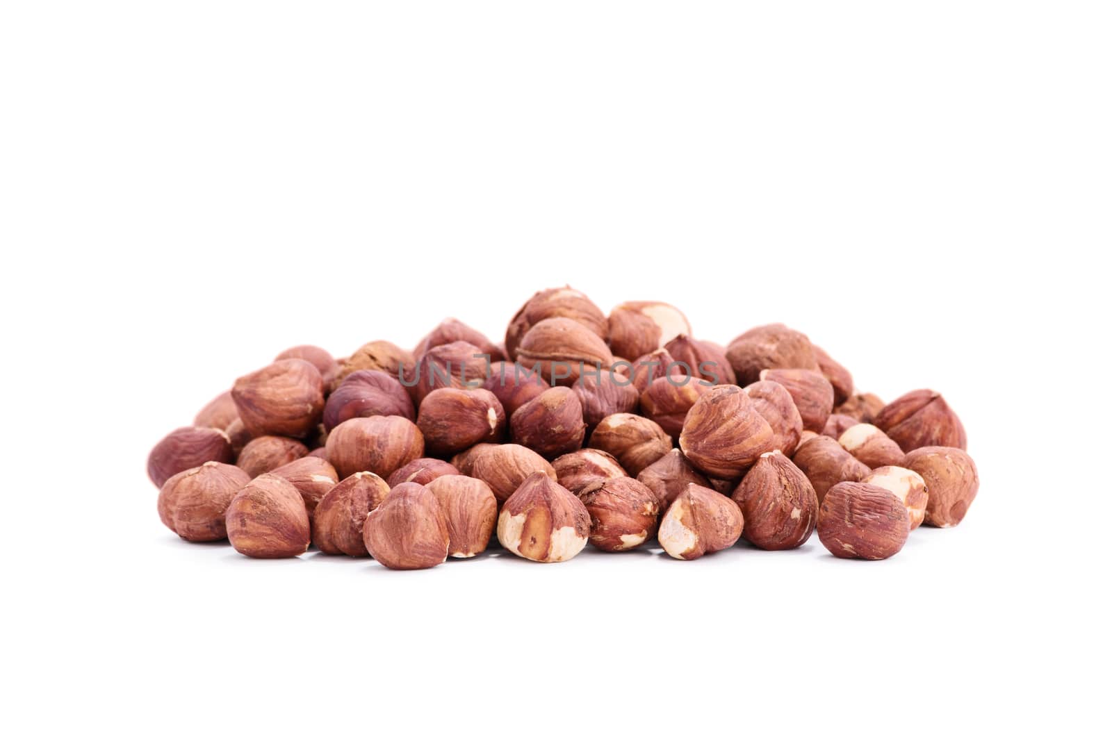 Close up shot of heap of hazelnuts, isolated on white background.