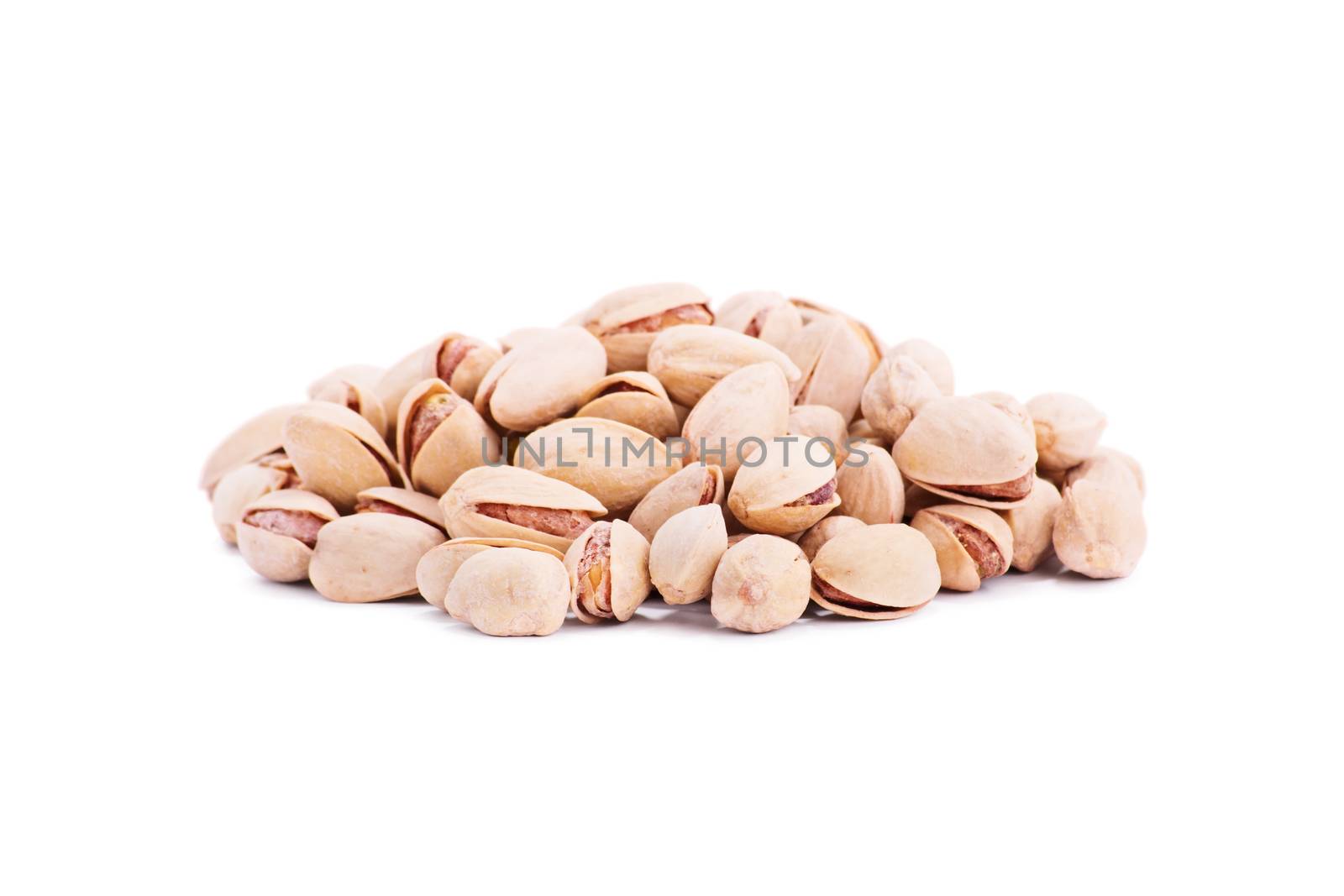 Close up shot of heap of pistachios, isolated on white background.