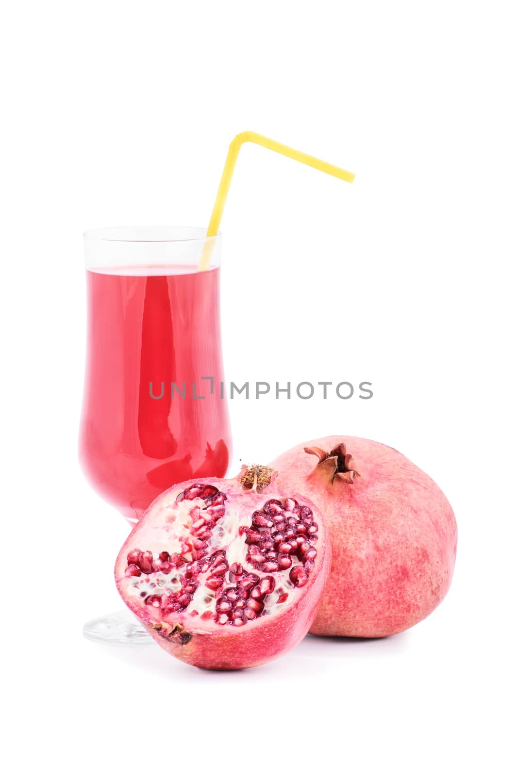 Ripe pomegranate with glass of pomegranate juice, isolated on white background.