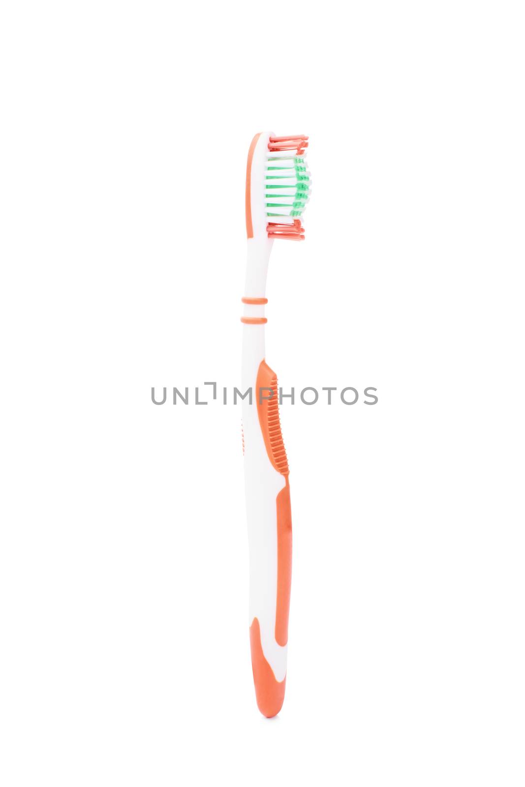 Close-up shot of a vertically placed toothbrush, isolated on white background.