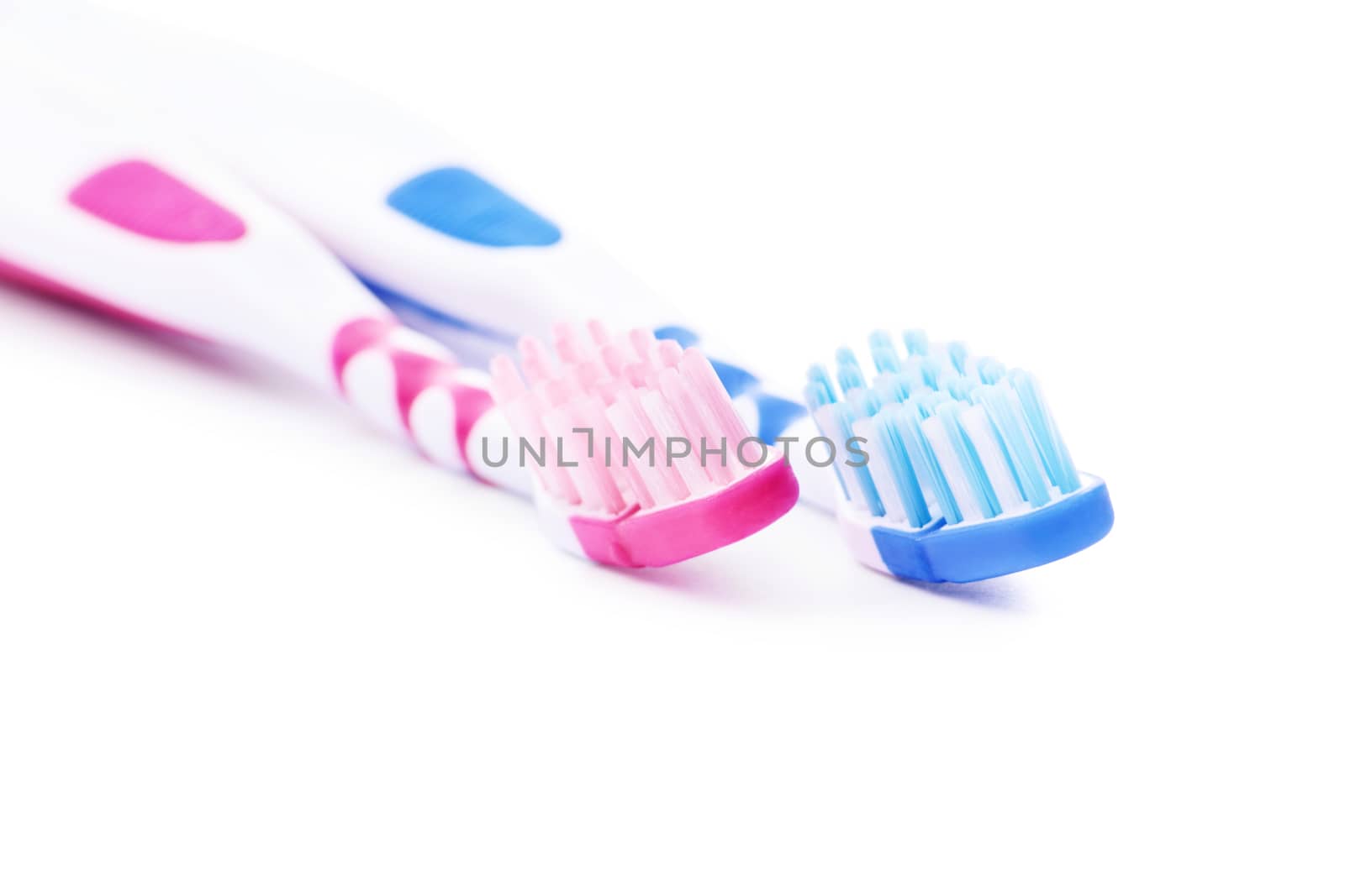 Set of toothbrushes, for him and her, isolated on white background.