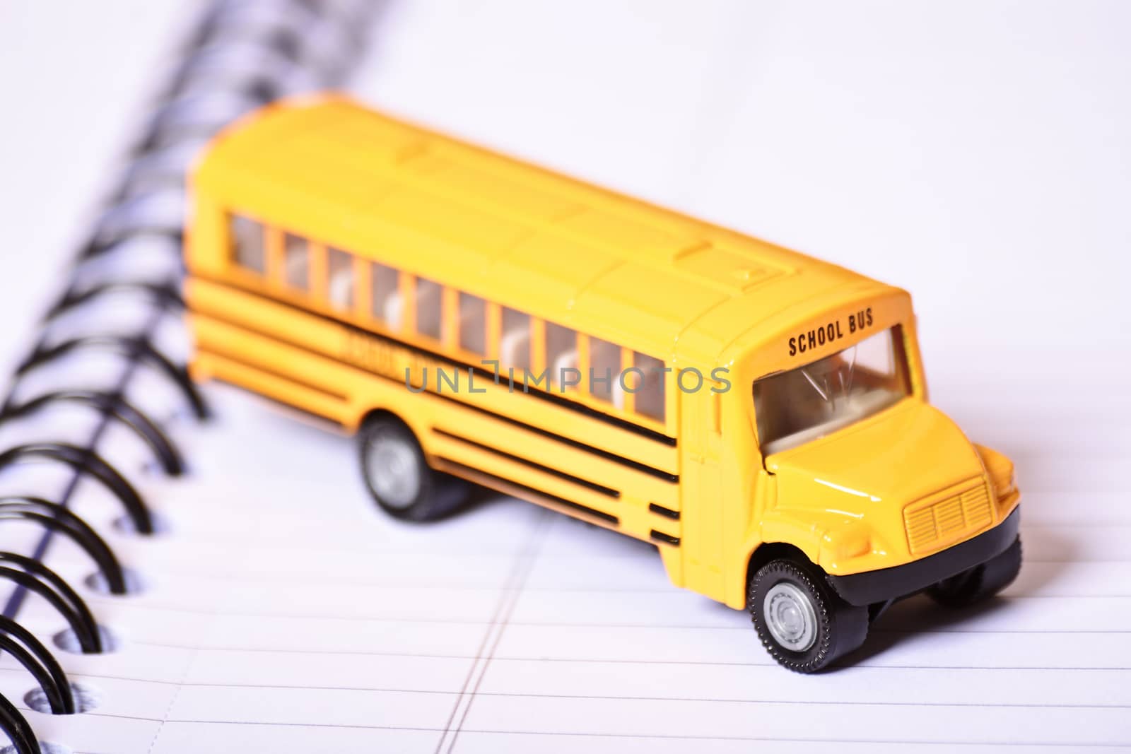 Close up of a toy school bus  by Mendelex