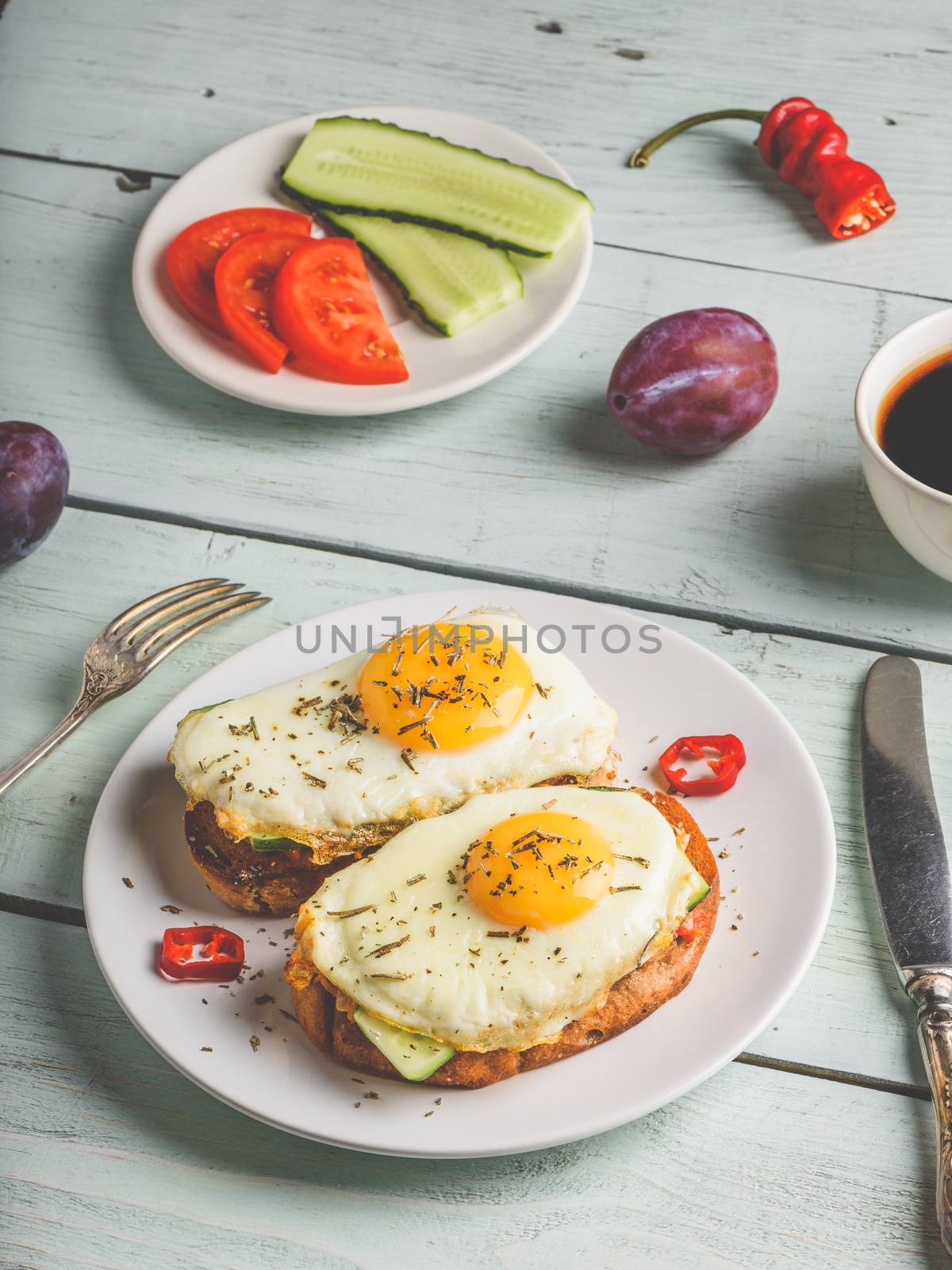 Sandwiches with vegetables and fried egg and cup of coffee by Seva_blsv