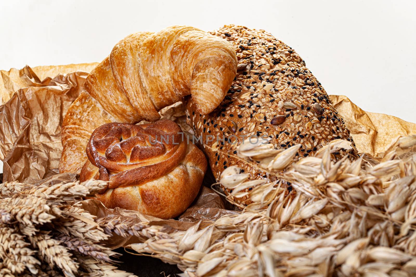 Different kinds of bread on a glass background