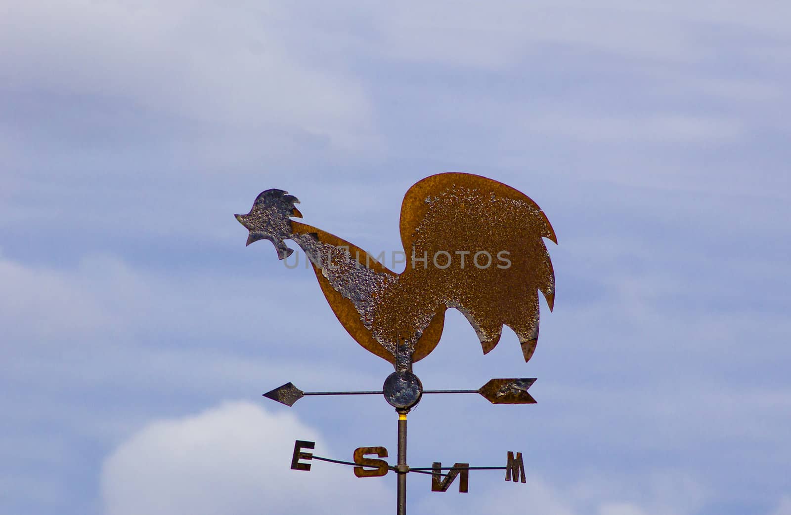 
Weather vane-cock of metal, with arrows showing the direction of the light.