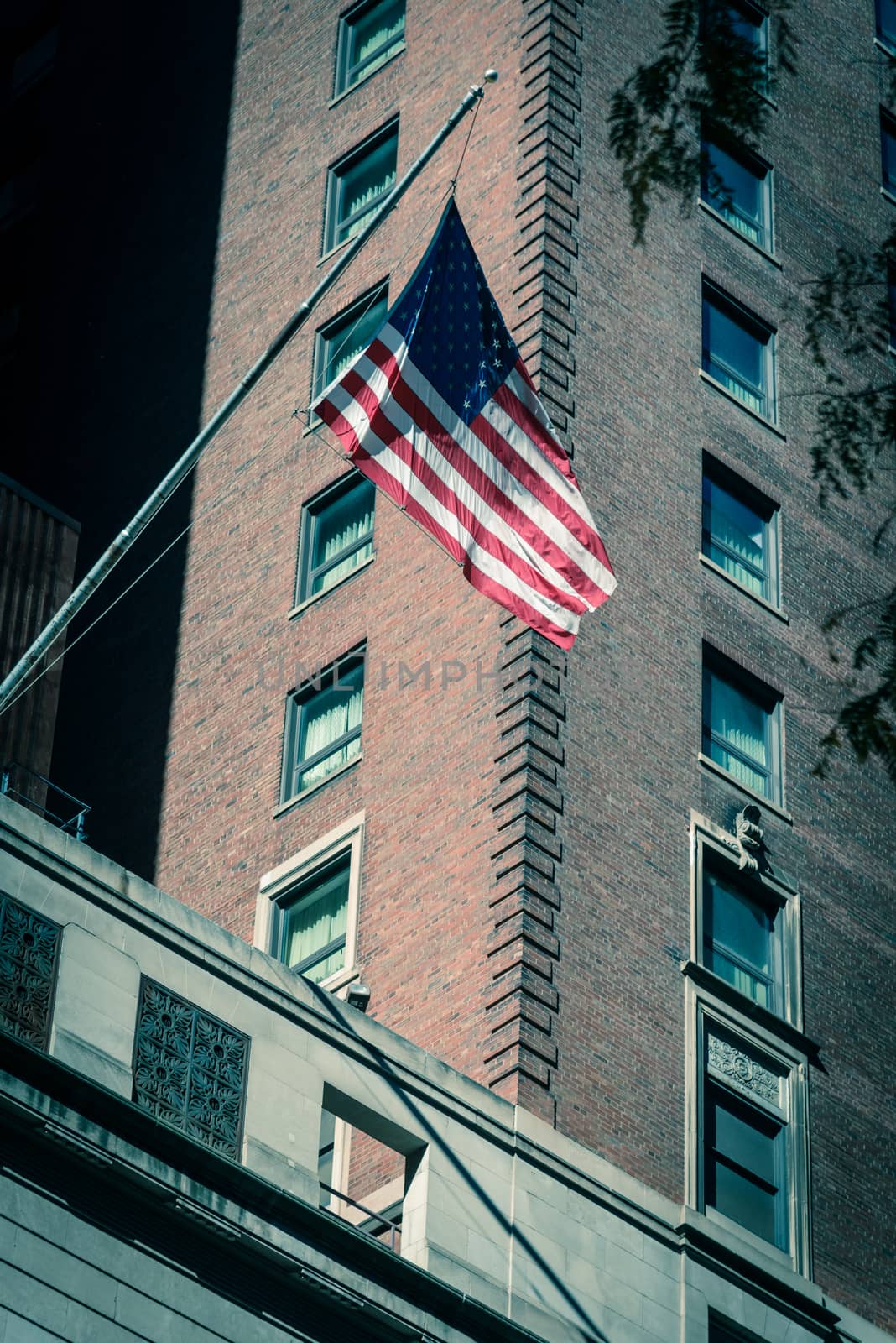 Filtered image waving American flag on federal buildings in downtown Chicago by trongnguyen