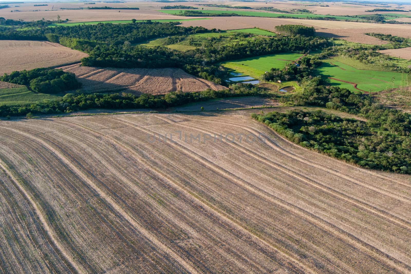 Mosaic landscape of farms, crops, forests, pastures and aquaculture.