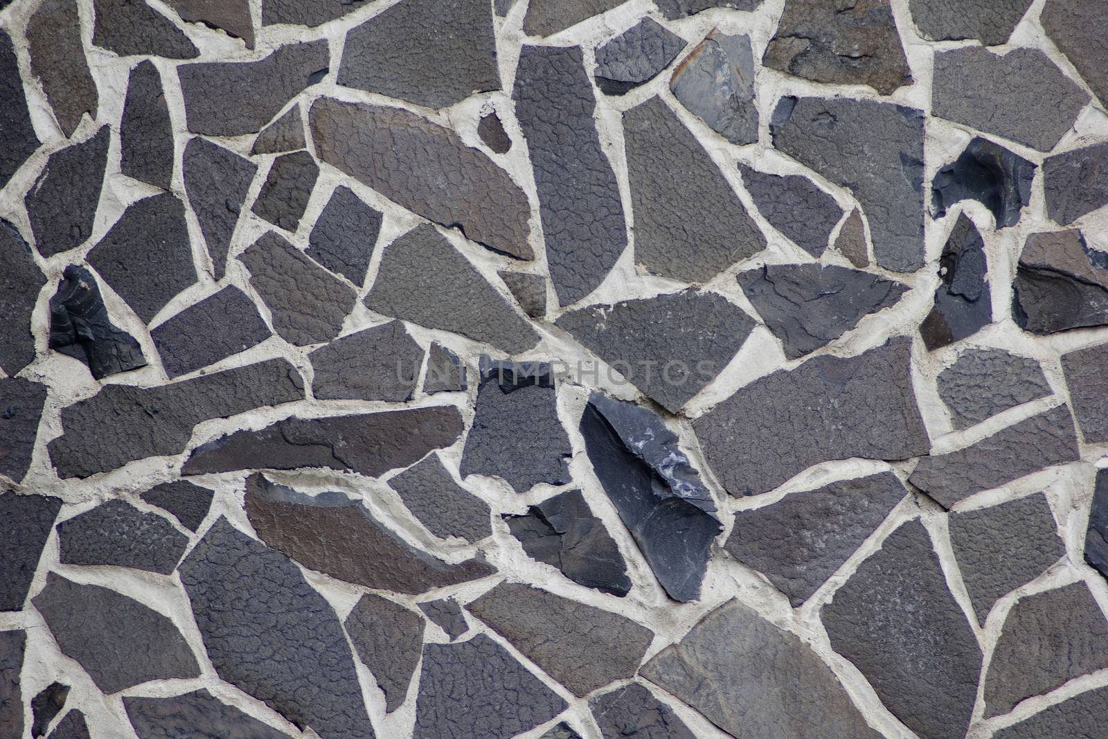 Texture of flat granite blocks of different sizes of dark color. by Igor2006