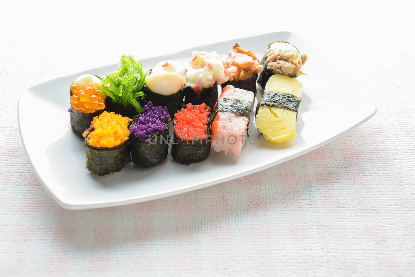 Sushi on white plate, tuna, salmon, sea bass, sweet egg, shrimp  by yuiyuize