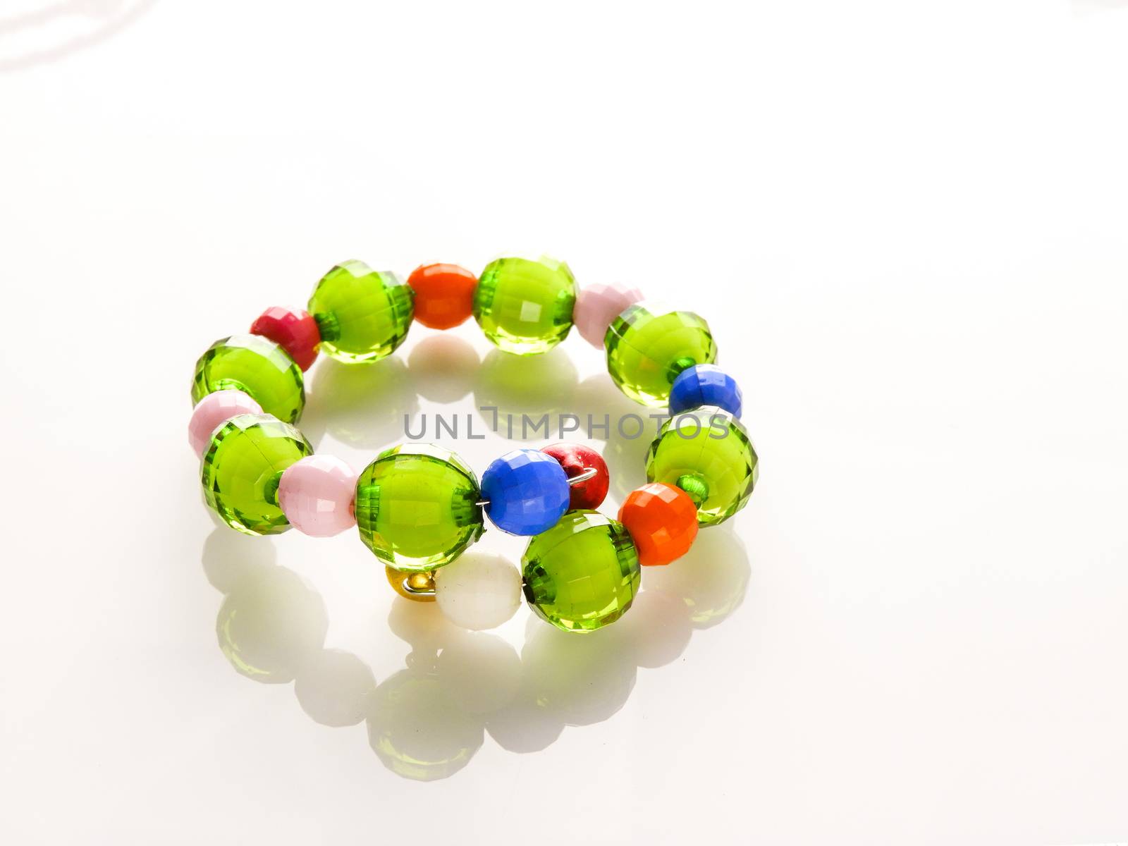 Multi-colored bracelets with beads. Colourful child's bead bracelet.
