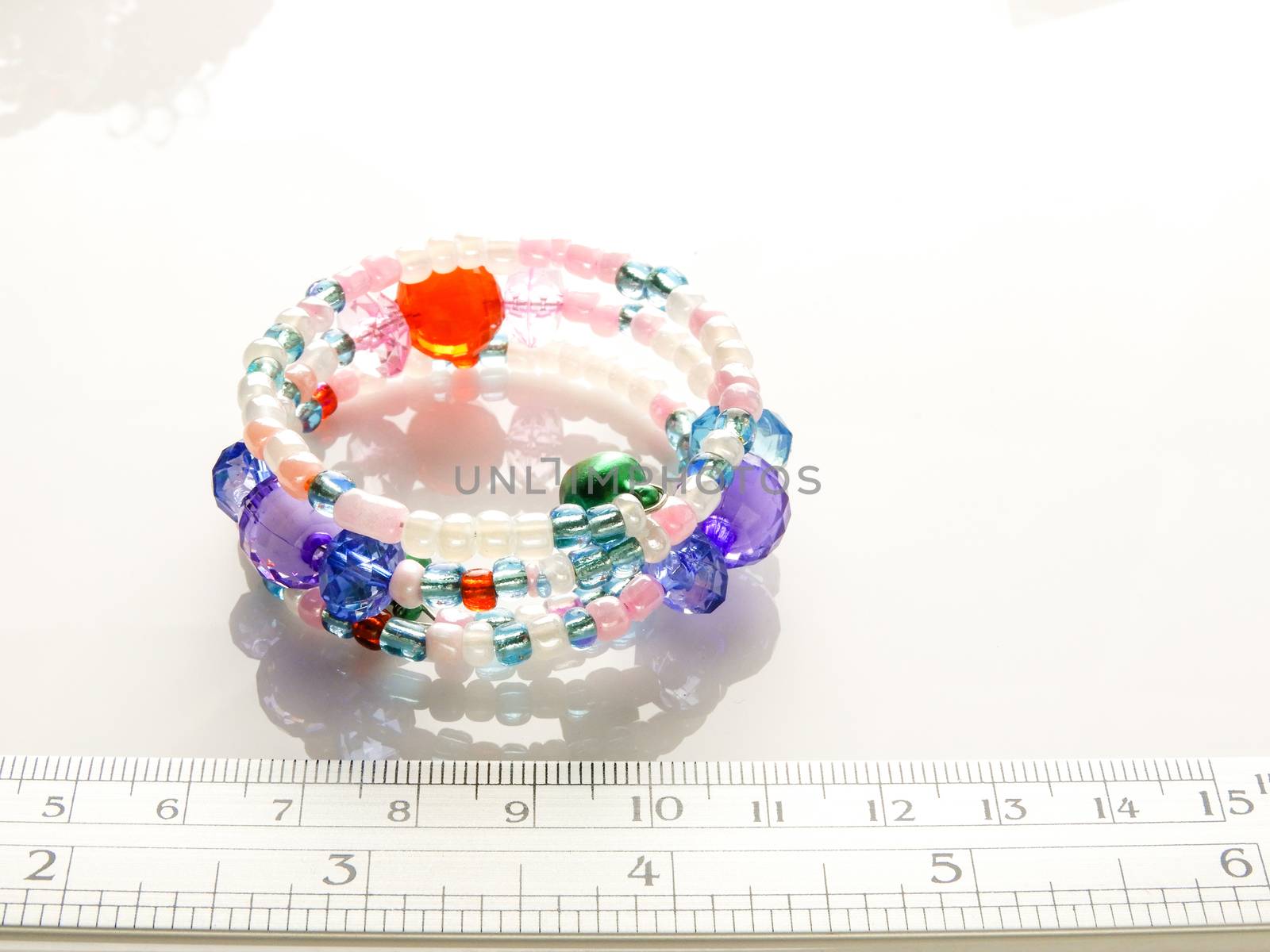 Multi-colored bracelets with beads. Colourful child's bead brace by yuiyuize