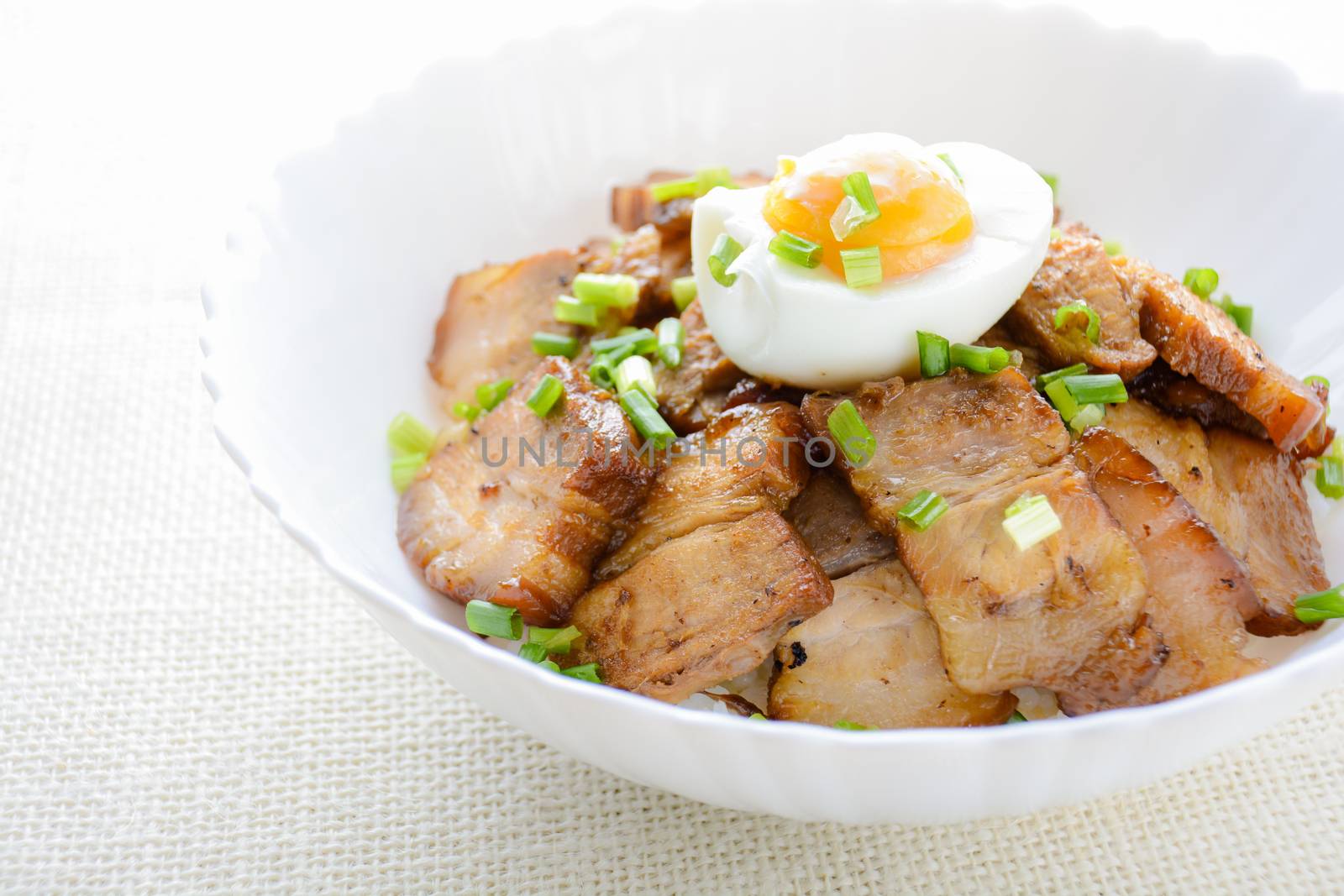 Bowl of rice topped with Braised pork belly and boiled egg, Japanese called Kakuni-don
