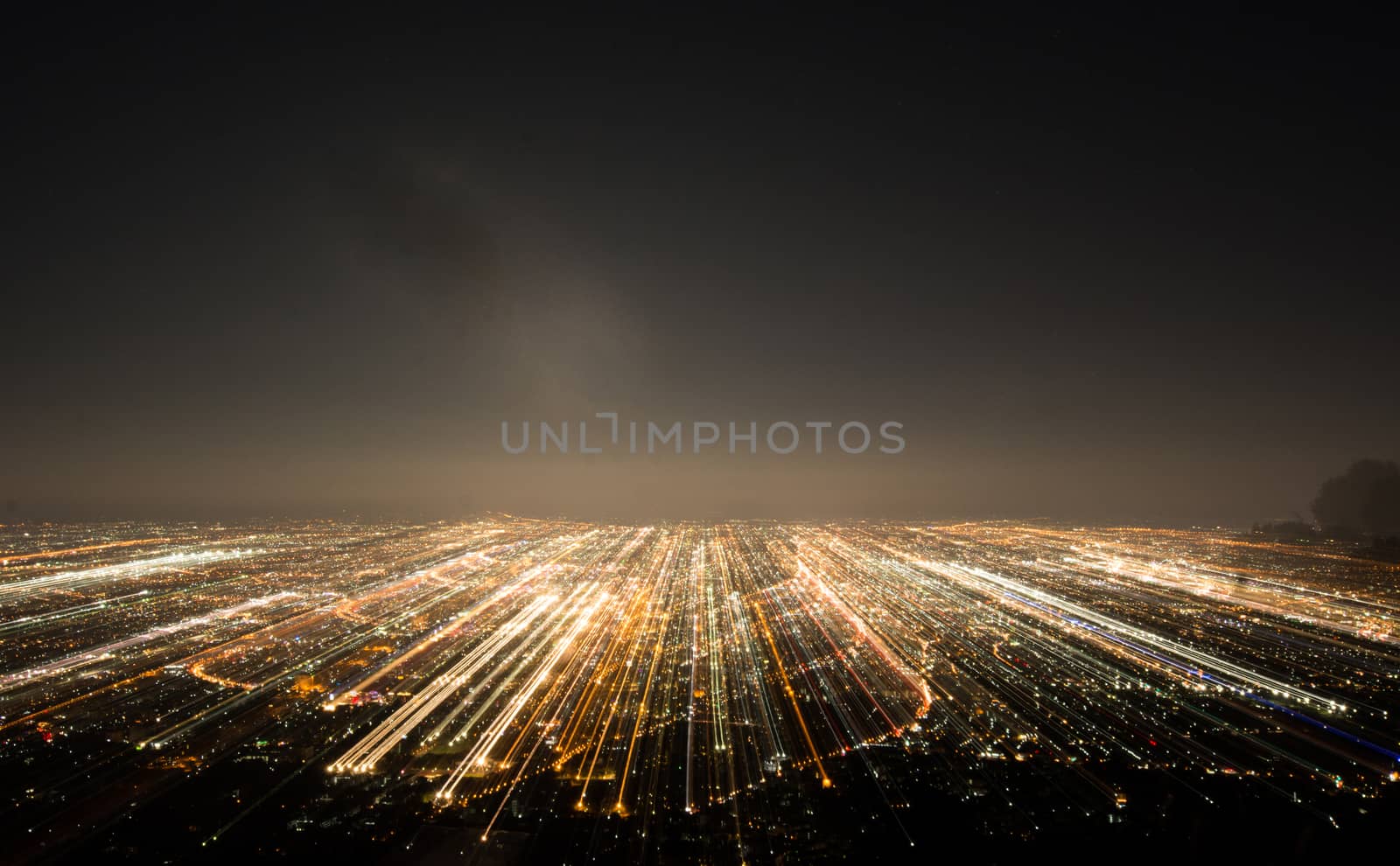 Abstract long exposure, experimental surreal photo, city and vehicle lights at night
