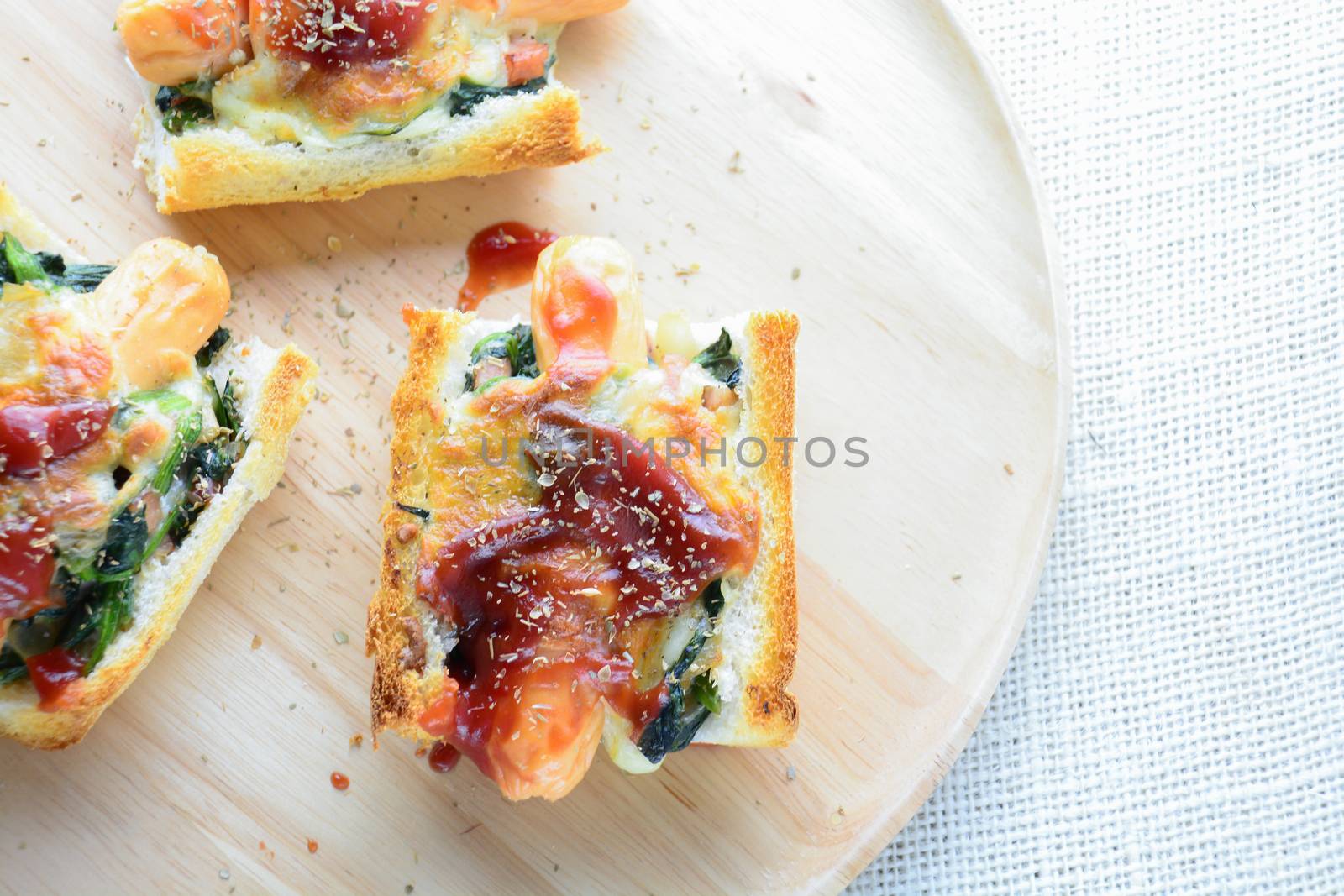 Baked Spinach with Cheese, sausage on Baguette, French bread
