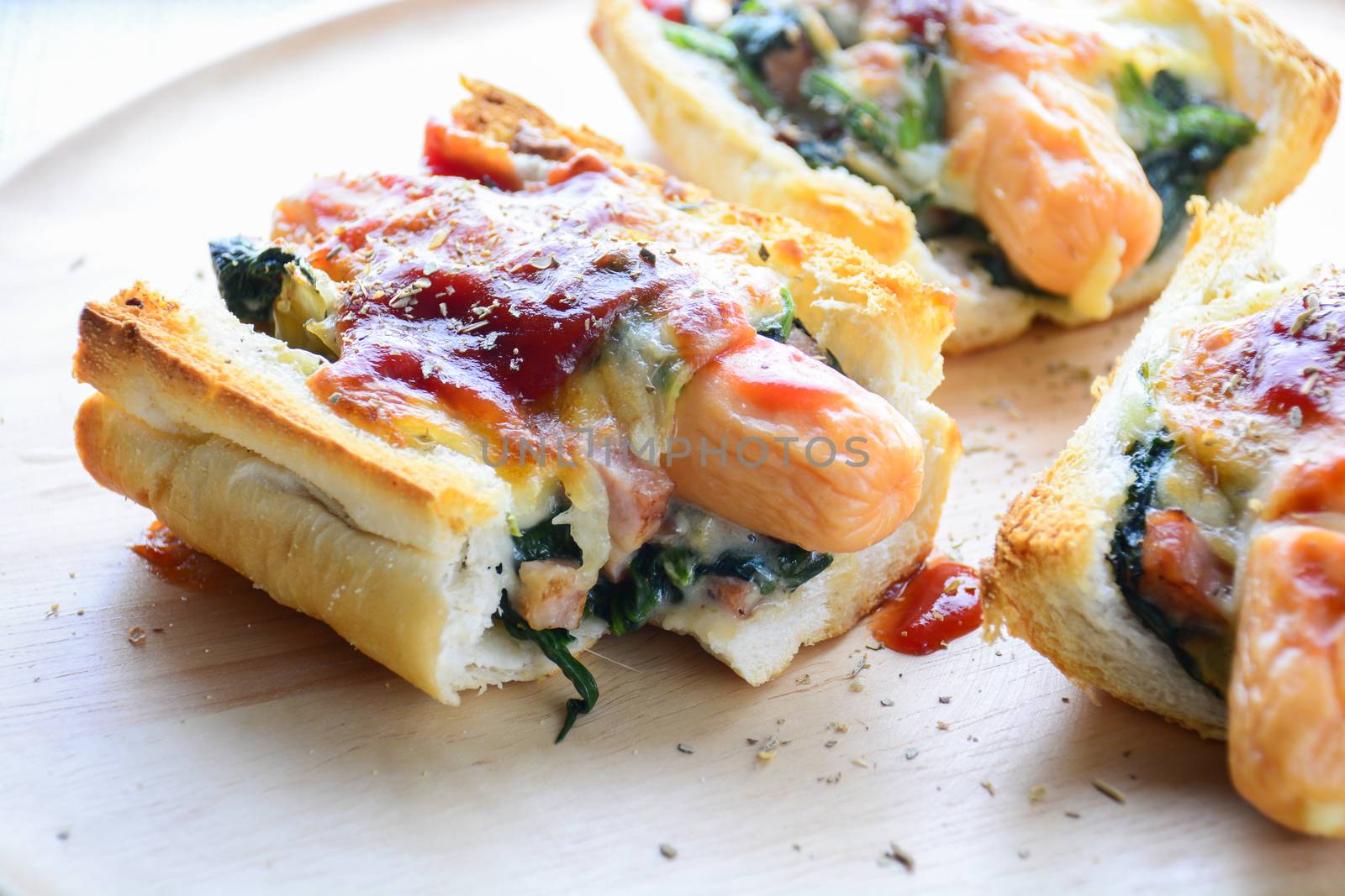 Baked Spinach with Cheese, sausage on Baguette, French bread
