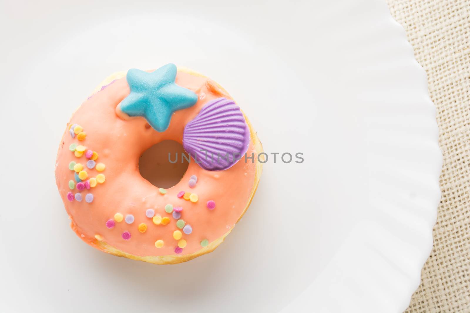 Donut on a white plate, donut with white background

