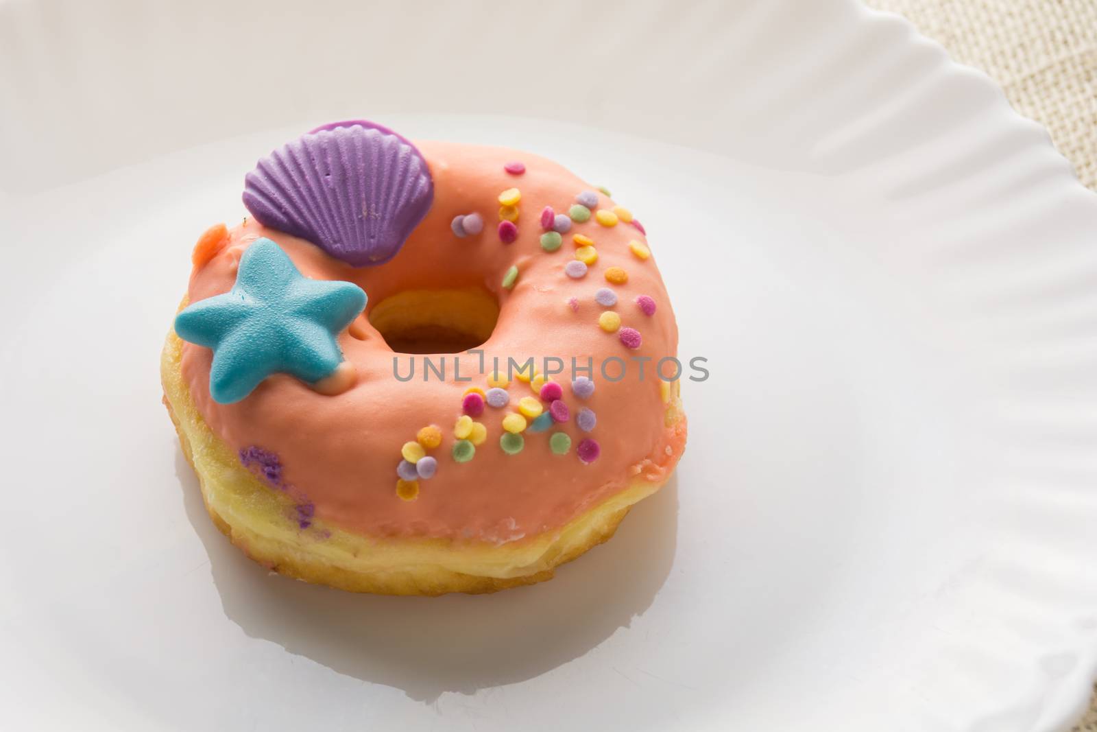 Donut on a white plate, donut with white background
