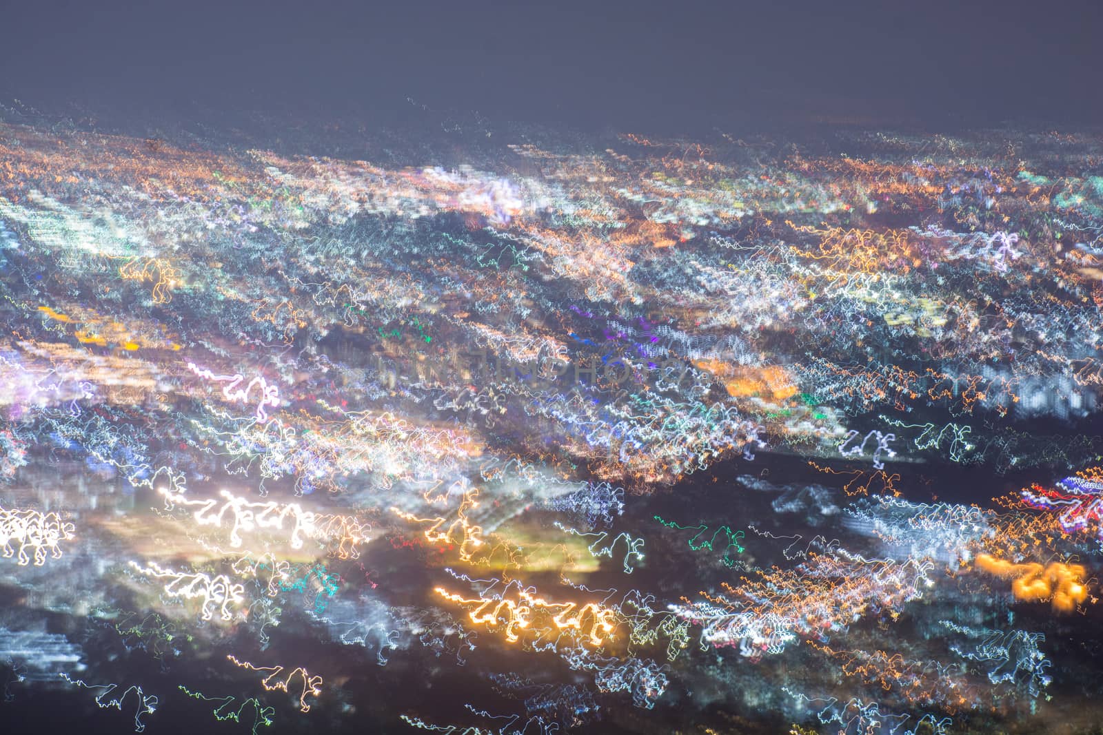 Abstract long exposure, experimental surreal photo, city and vehicle lights at night
