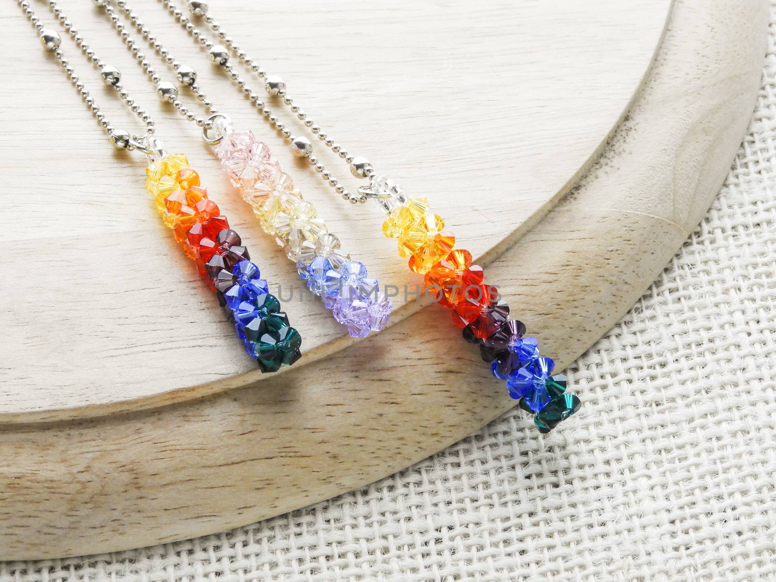 Pendant crystals and diamonds. Gemstone crystal pendant, silver color, various colors.
