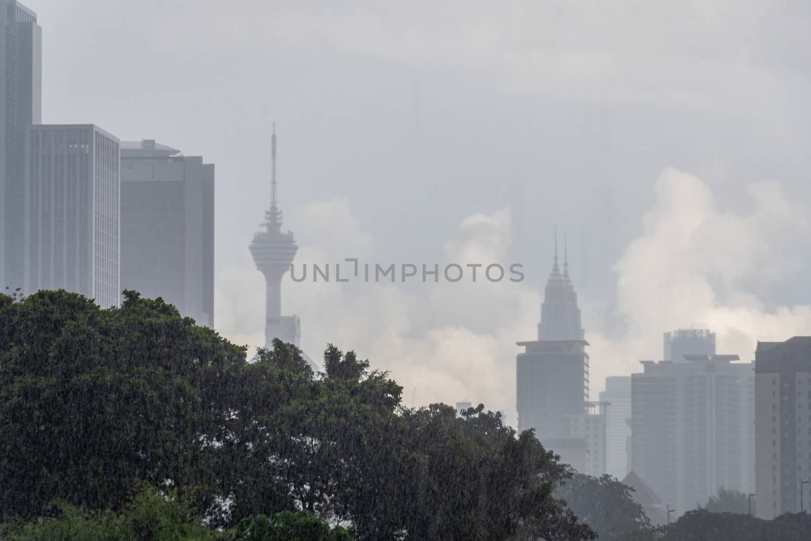 Heavy rainfall in Kuala Lumpur during monsoon season in Malaysia by MXW_Stock