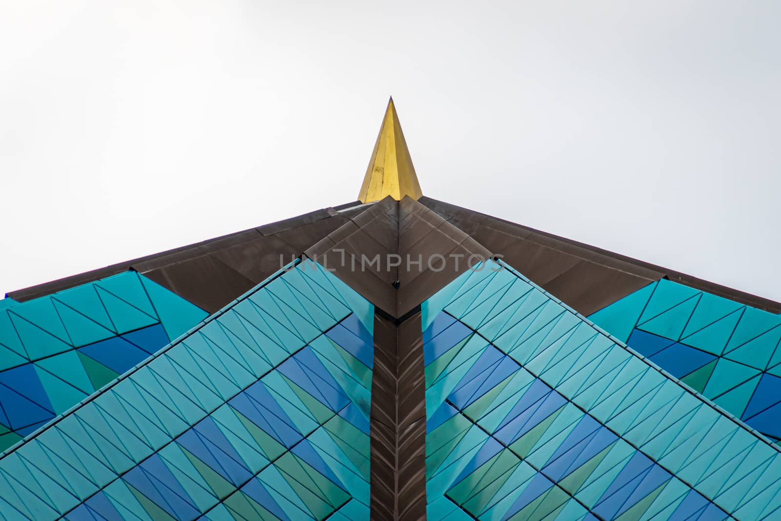 Masjid Negara mosque roof with golden spike in Kuala Lumpur by MXW_Stock