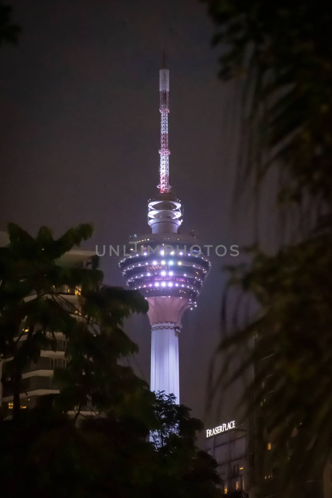 Menara Tower Kuala Lumpur illuminated during night by MXW_Stock