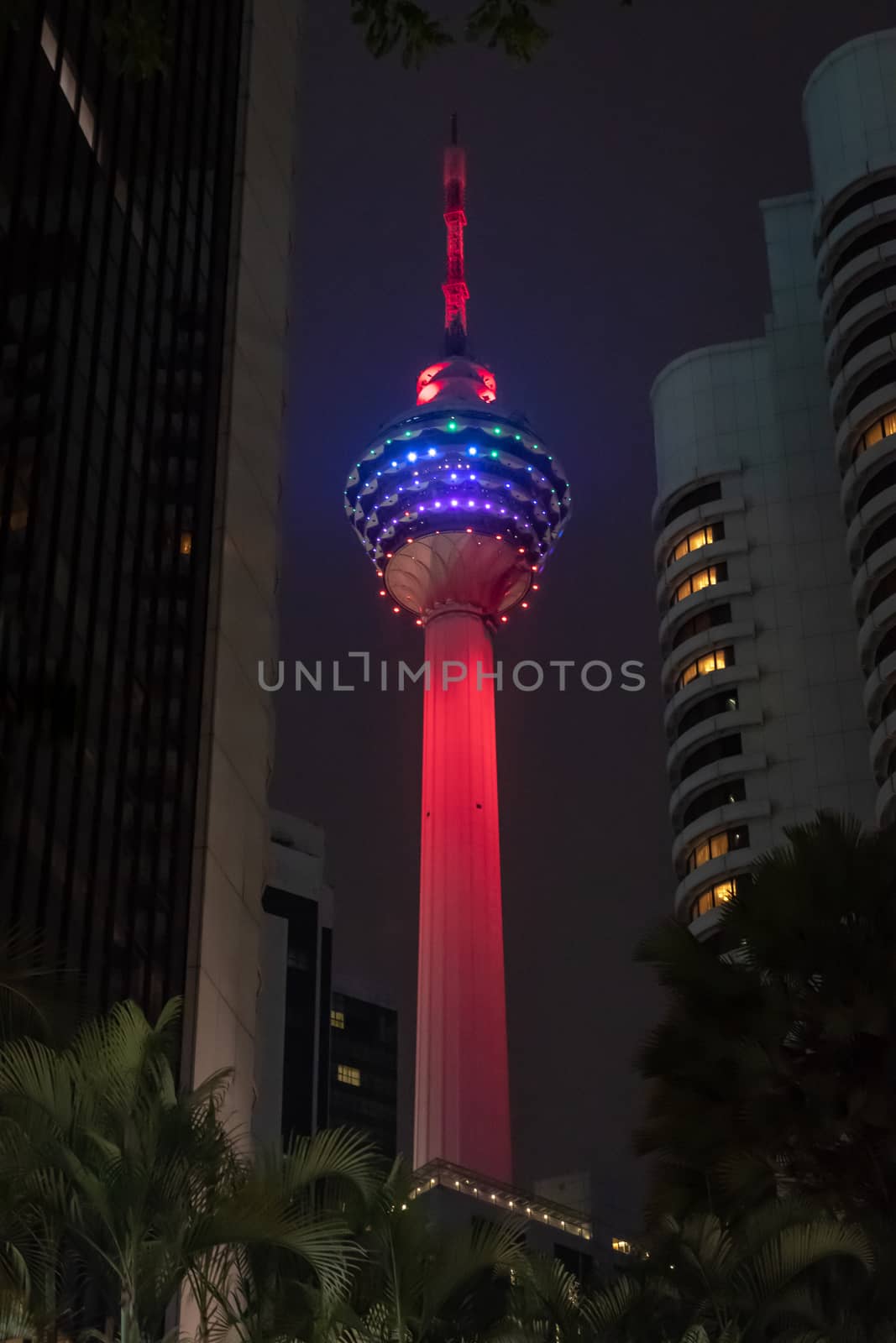 Red illuminated big transmission tower in Kuala Lumpur
