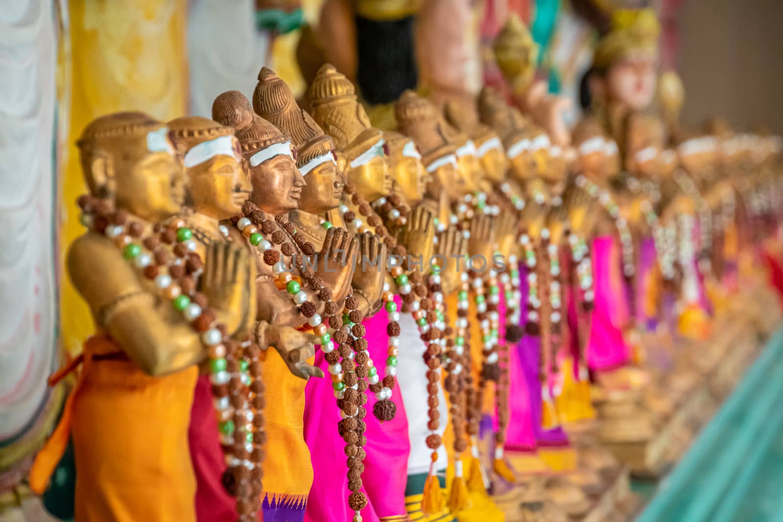 Sri Mahamariamman Temple golden statues with colorful fabric in Kuala Lumpur by MXW_Stock