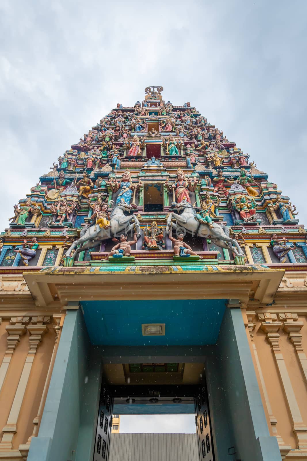 Sri Mahamariamman Temple main tower with colorful figures in Kuala Lumpurs oldest Hindu temple by MXW_Stock