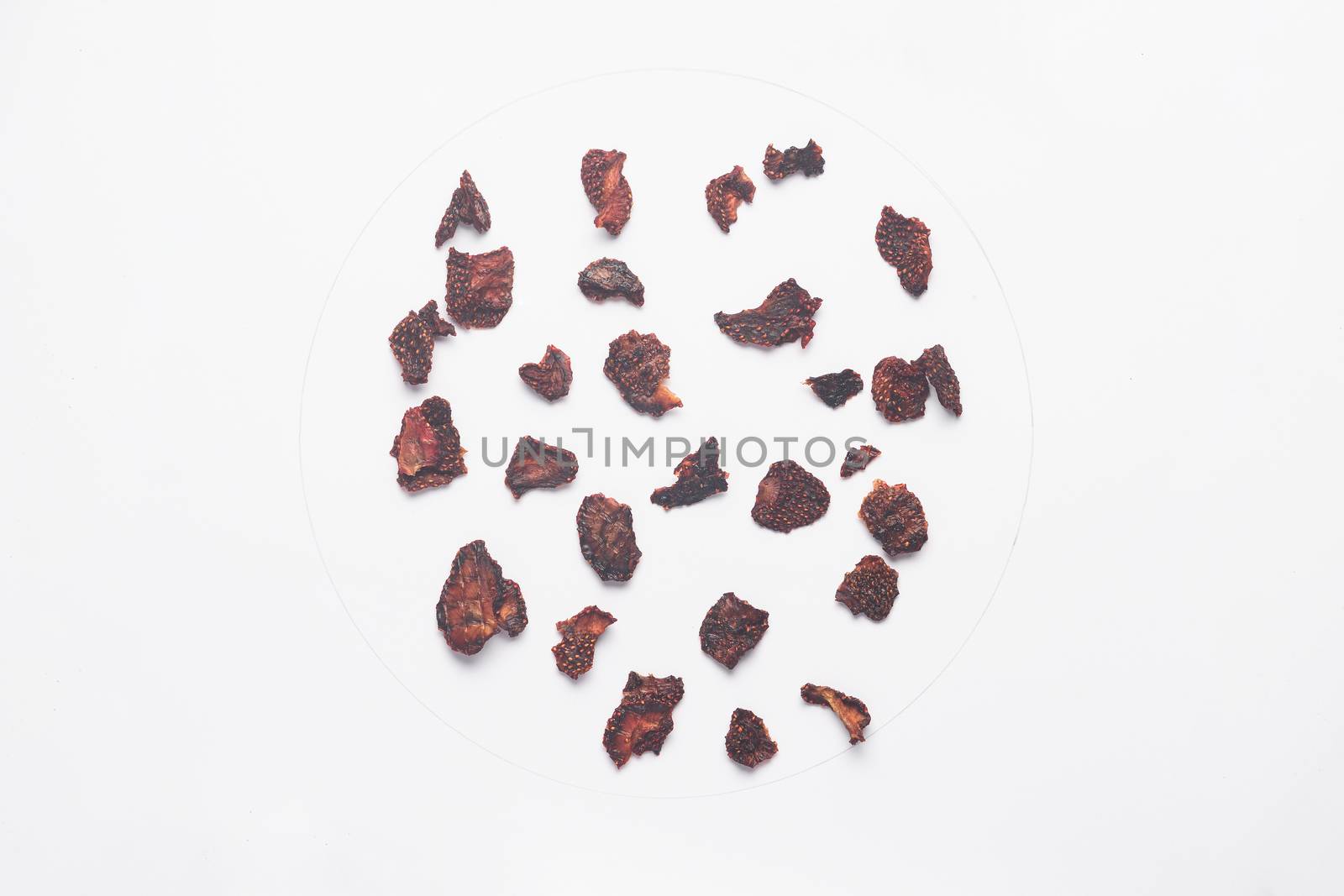 Dried strawberry chips isolated on white backgroud.  by alexsdriver