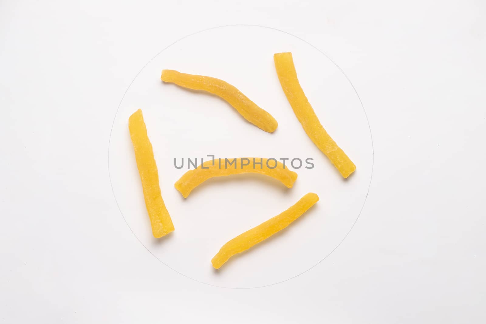 Candied cantaloupe pieces isolated on white backgroud. 