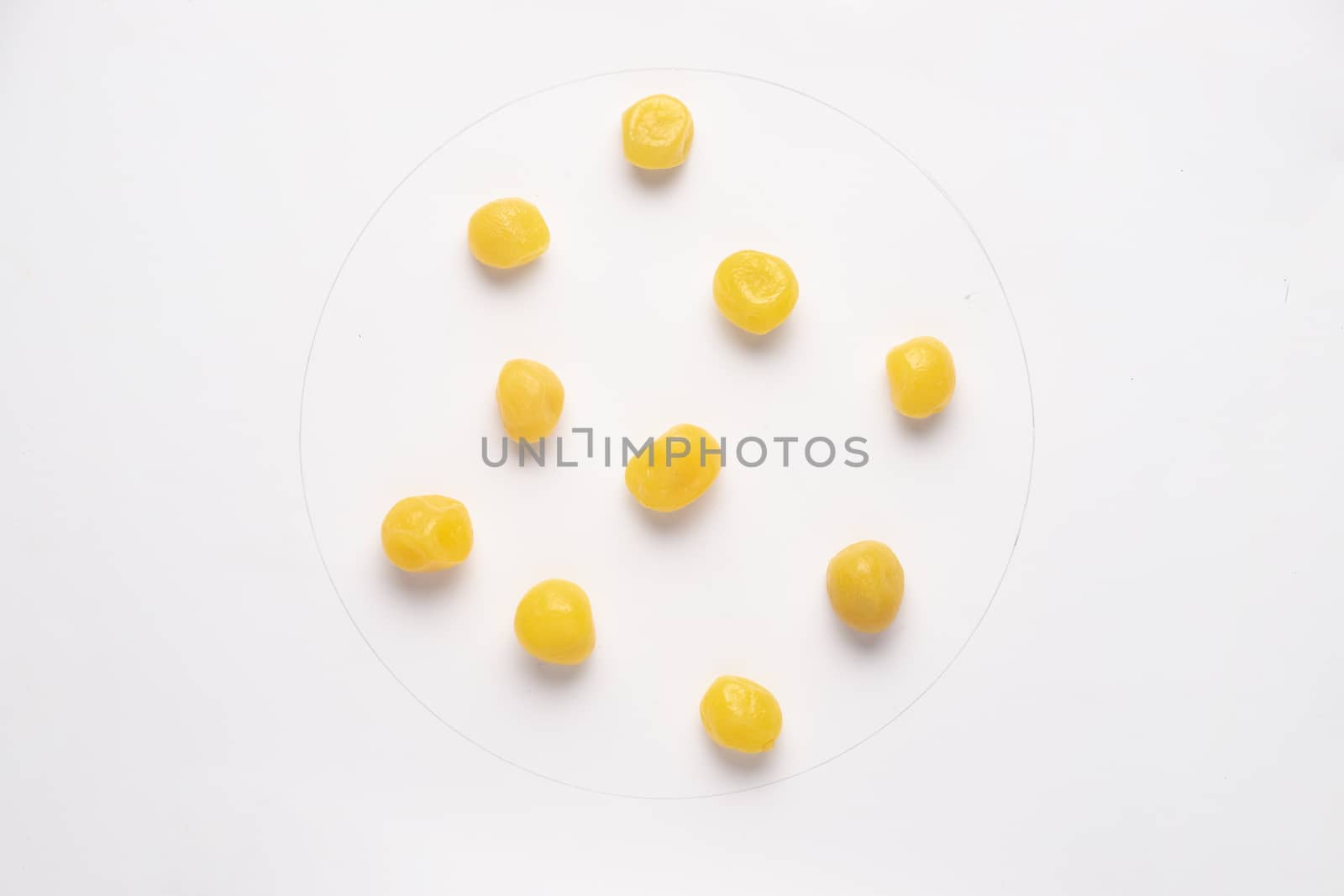 Small candied lemons isolated on white backgroud. 