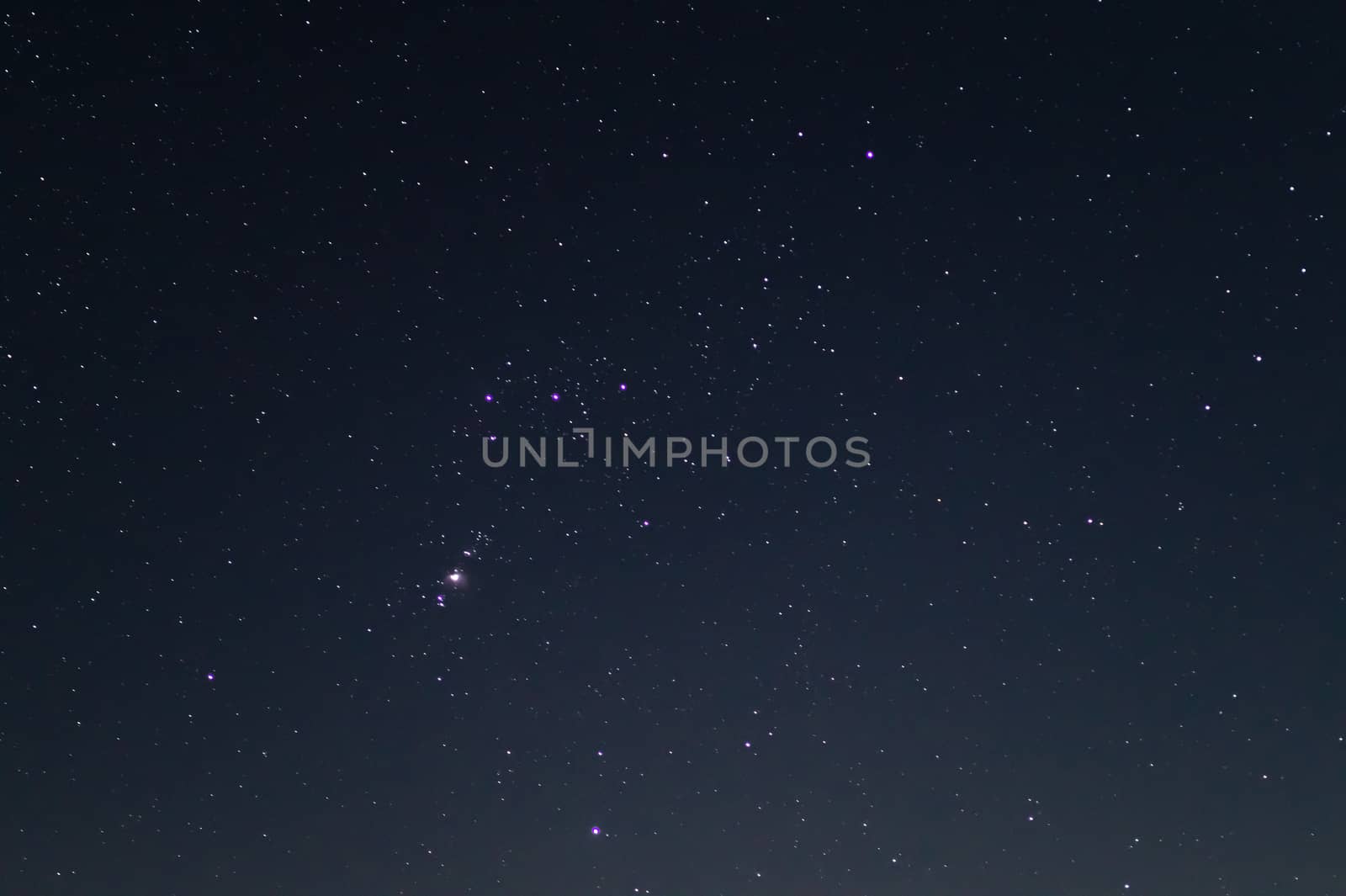 Night sky low light photo. A lot of stars and constellations on dark sky. Stock photo of deep sky. Far away from city and no clouds.