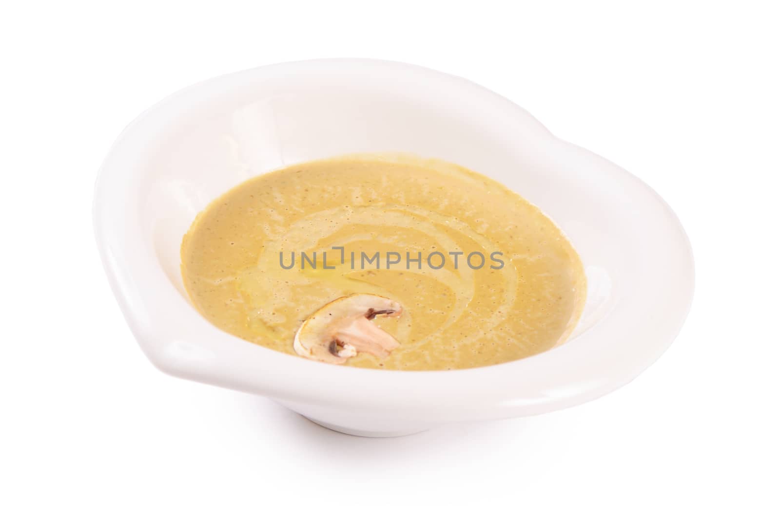 The mushroom cream soup with champignon close-up