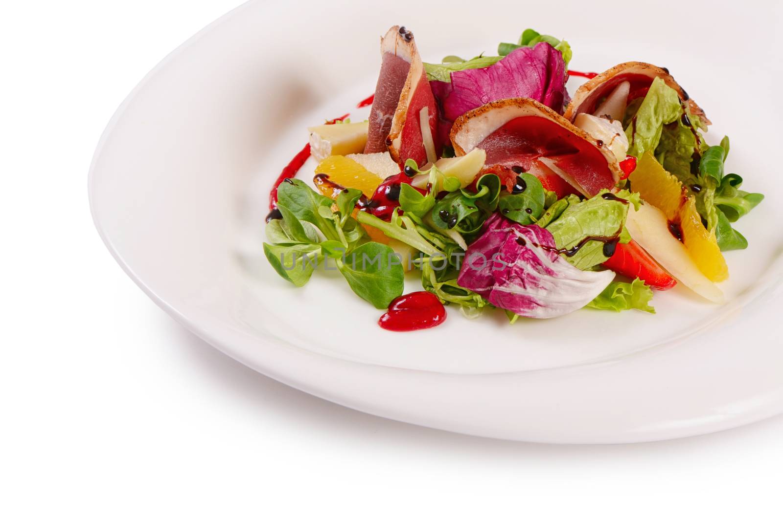 The salad with smoked duck breast close up by SvetaVo