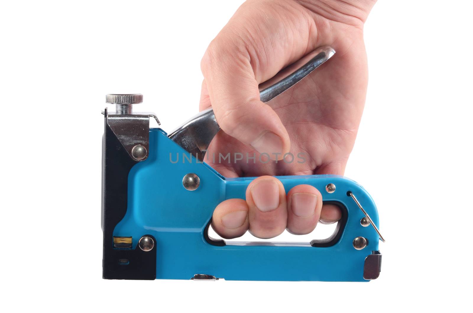 The furniture stapler in a man's hand isolated by SvetaVo