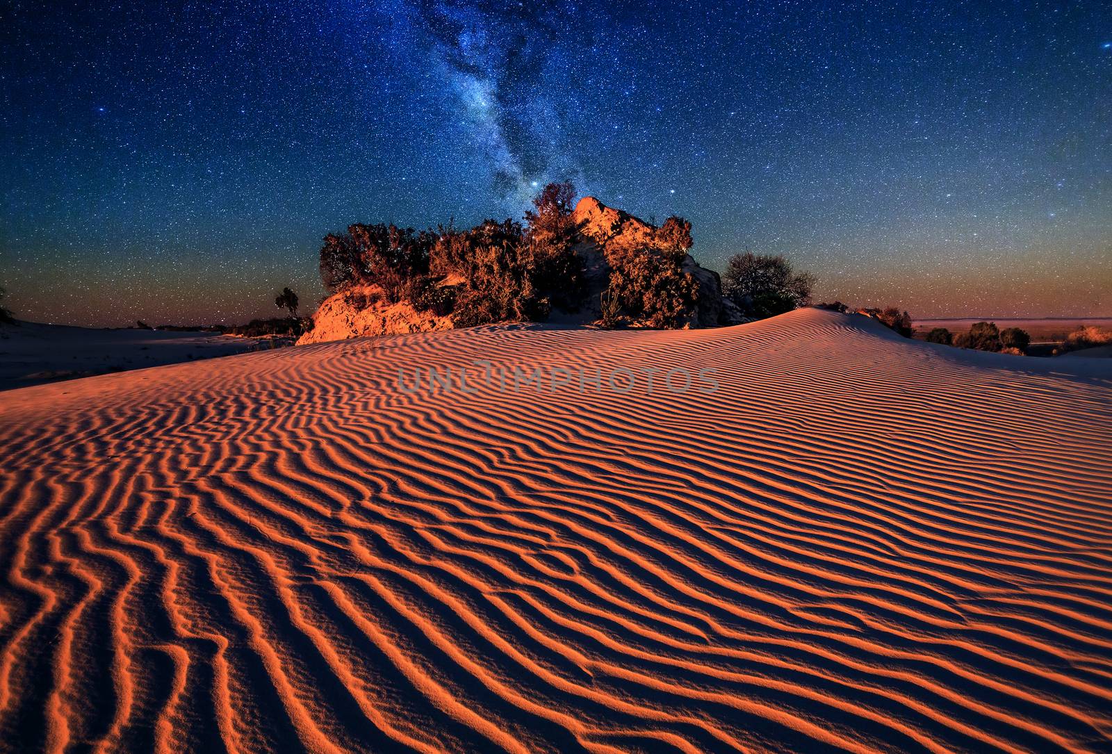 Sand dunes under starry night sky by lovleah