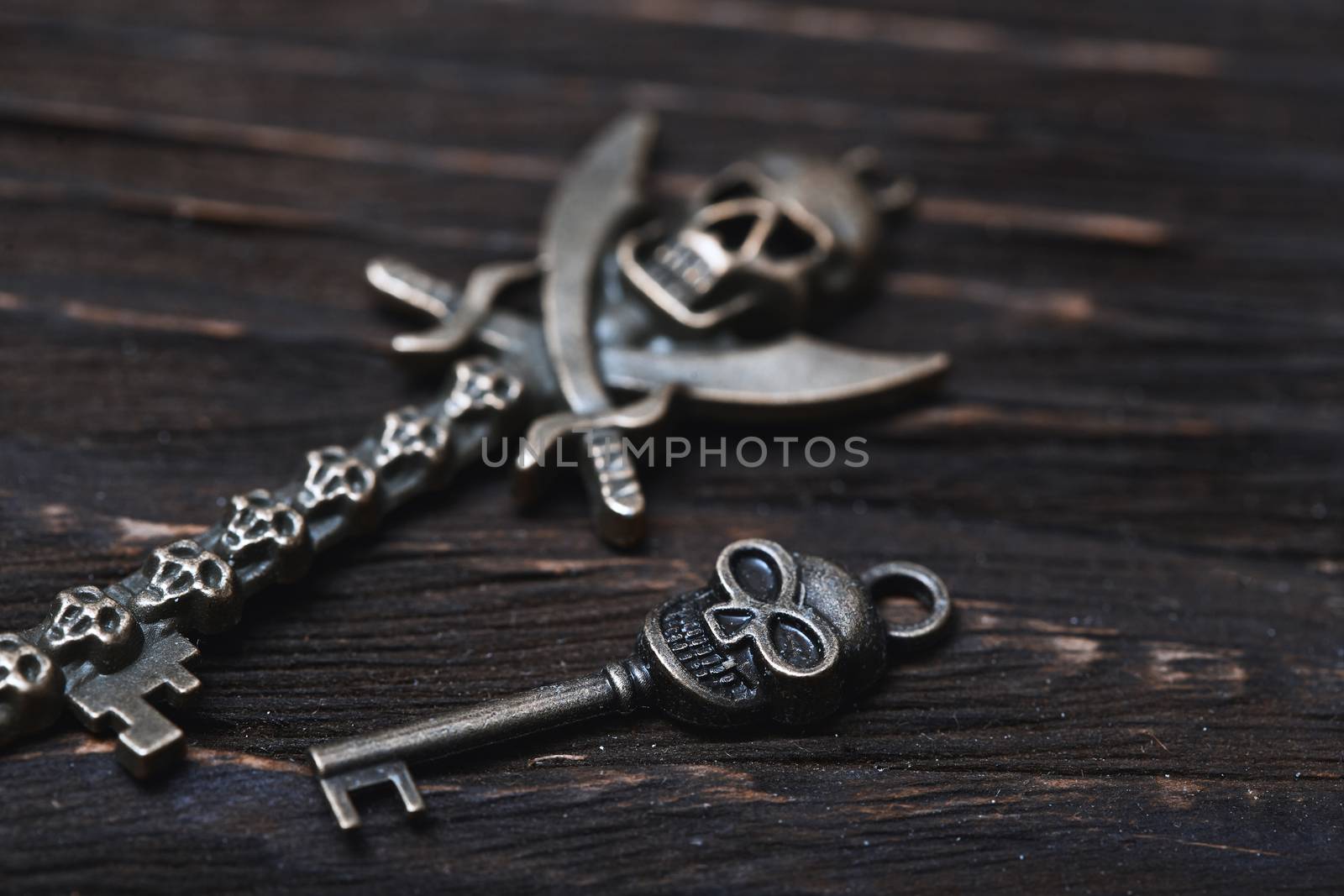 Vintage skull skeleton keys on a wooden table by Novic