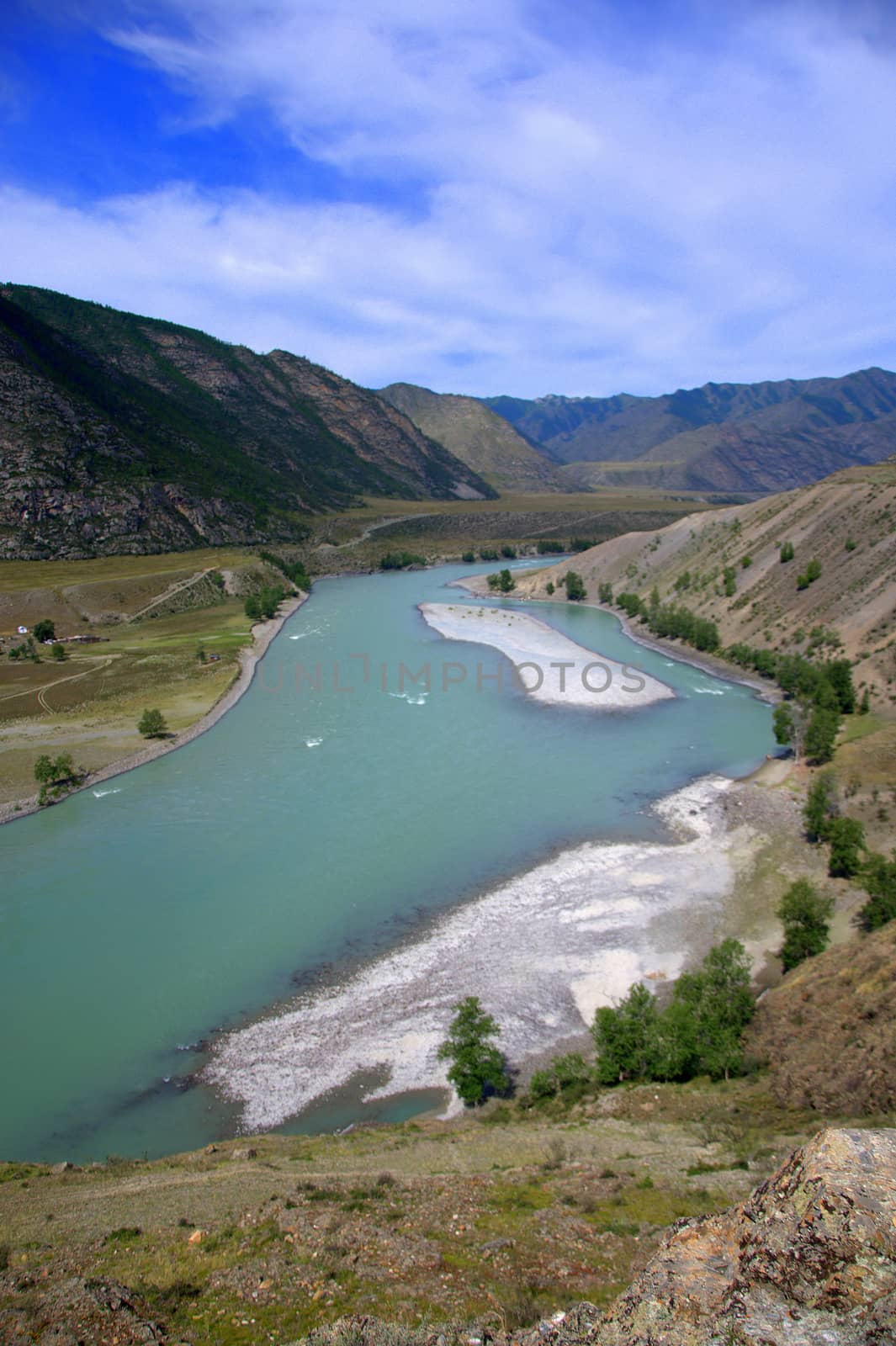 Beautiful turquoise river flowing through a mountain valley. Altai, Siberia, Russia.