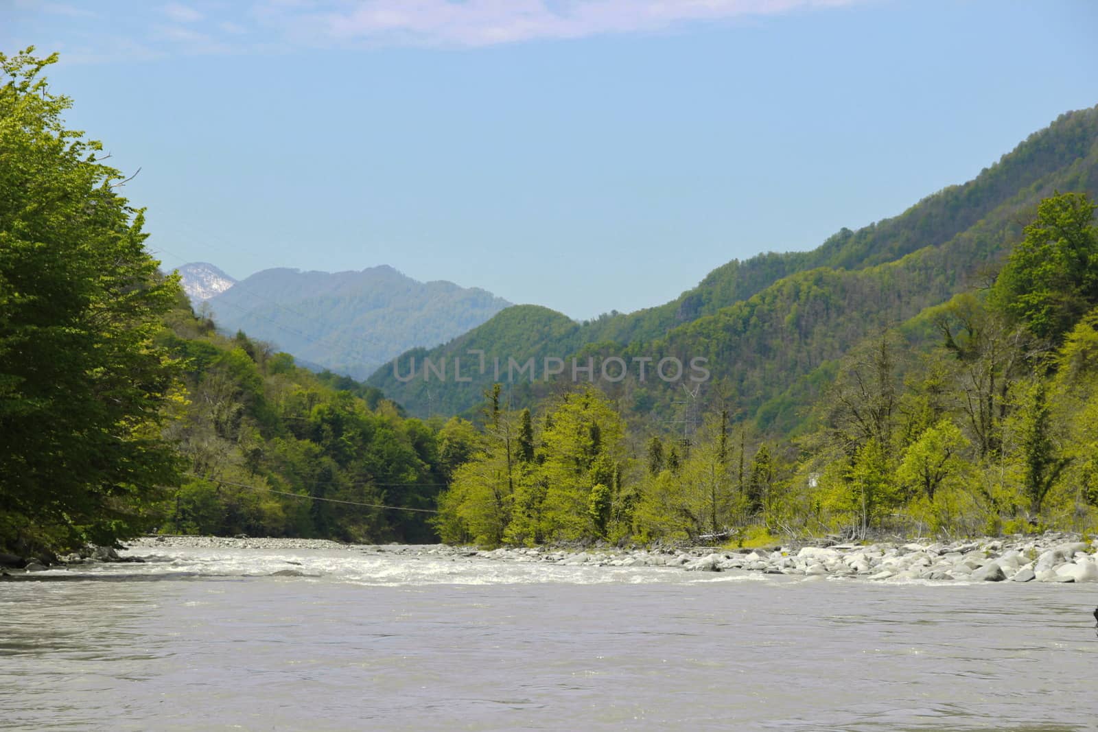 View on Acharistskali River and the snow-capped peaks of the mountains in the distance, view of the village of Makho, Georgia, Adjara, spring