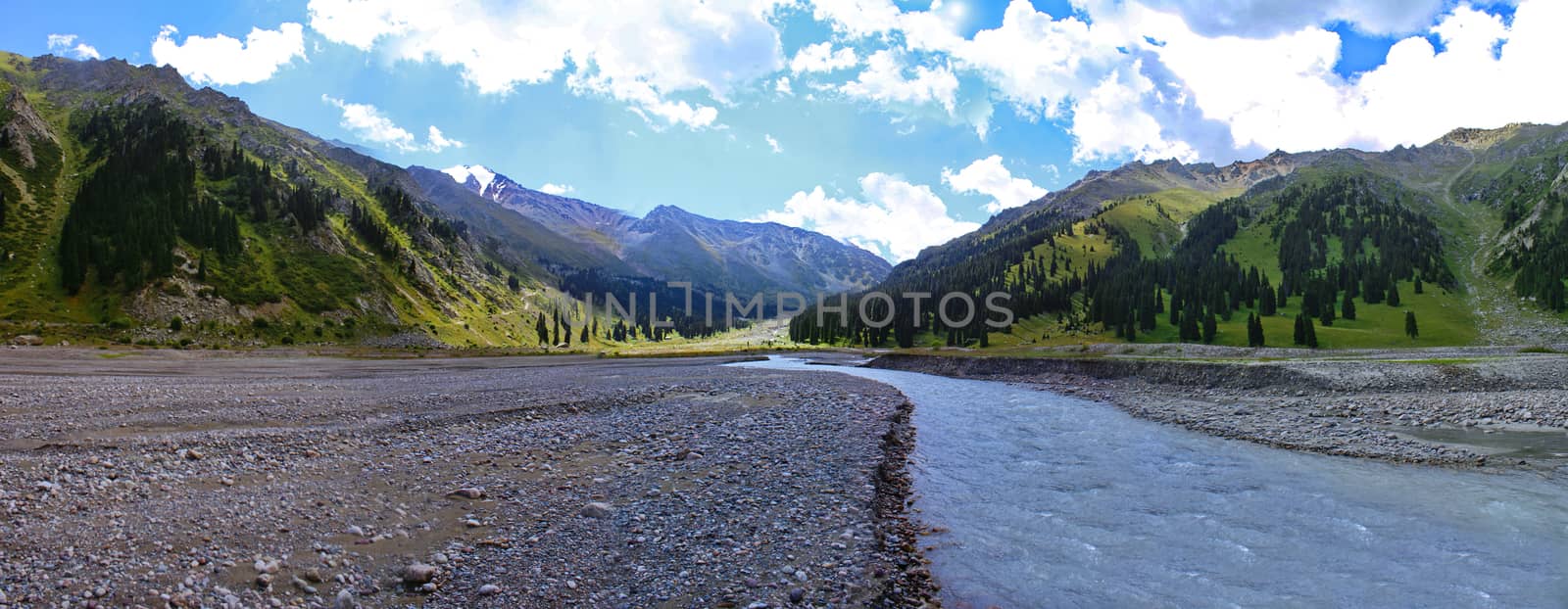 river originating in mountain glaciers and flowing into a Big Almaty lake in the mountains of Kazakhstan, summer