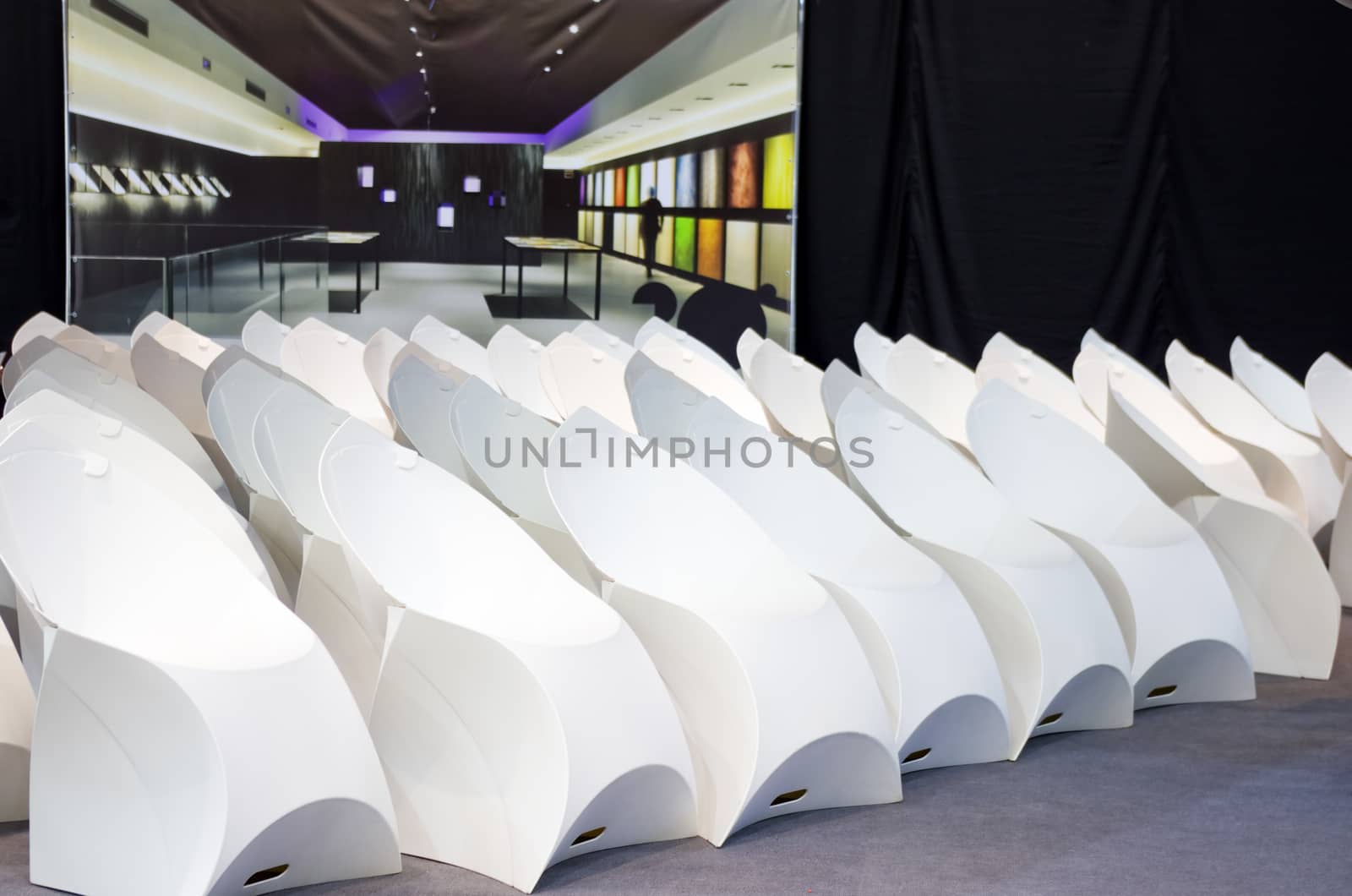 white modern chairs standing in a conference hall